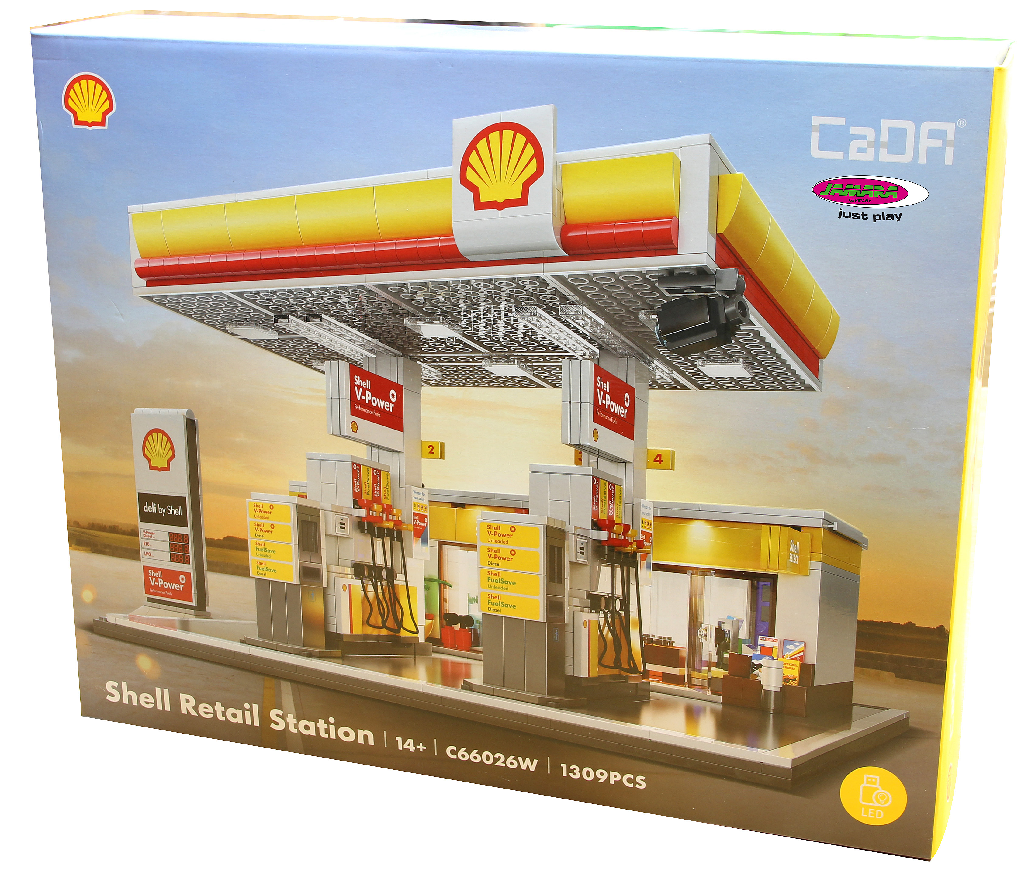 Kartonkunst zeigt ein Shell-Tankstellenmodell aus Blöcken. Es hat gelbes, rotes und weißes Branding und einen blauen Himmel.
