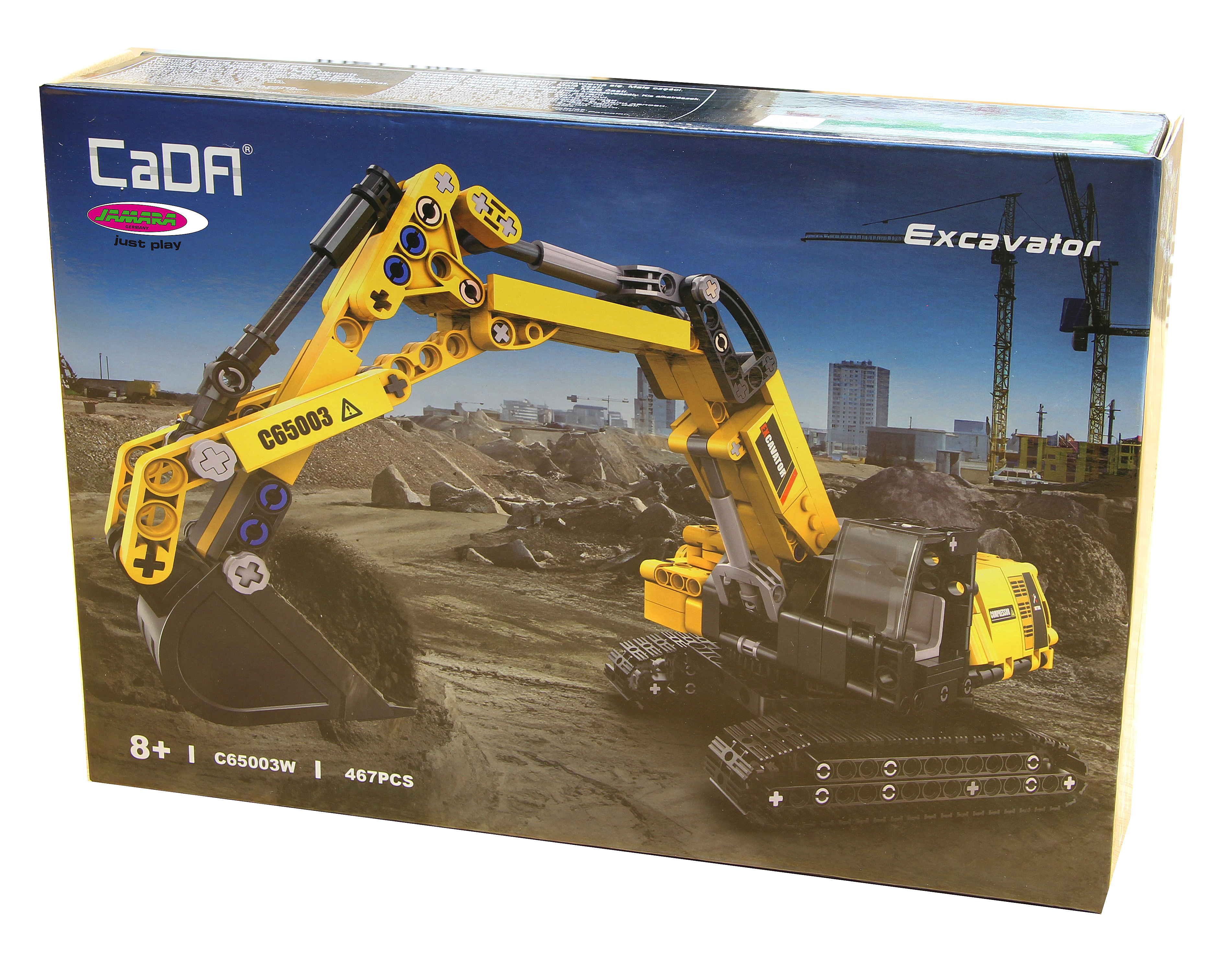 Eine Schachtel mit einem gelb-schwarzen Bagger-Spielzeug. Der Hintergrund zeigt eine Baustelle und Gebäude.