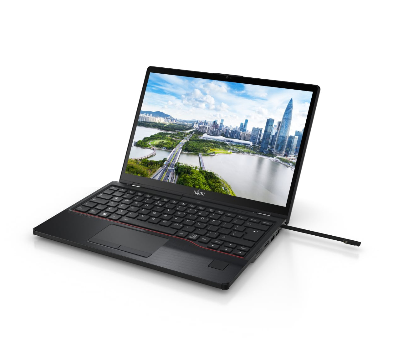 Czarny laptop Fujitsu wyświetla krajobraz miejski. Jest otwarty, pokazując klawiaturę i ekran z mostem i budynkami.