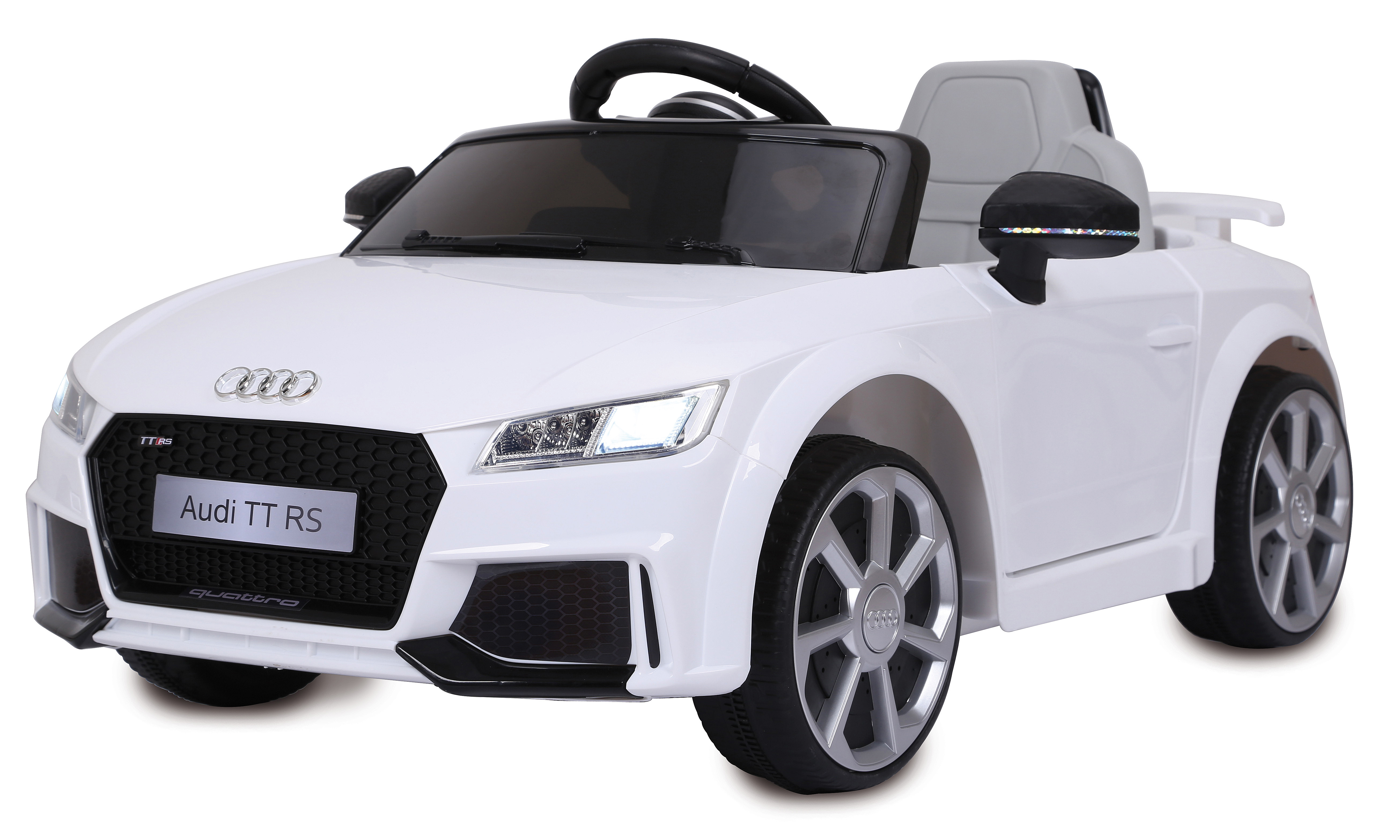 Un coche de juguete Audi TT RS blanco. Tiene interior negro, ruedas negras, y el logotipo de Audi es visible al frente.