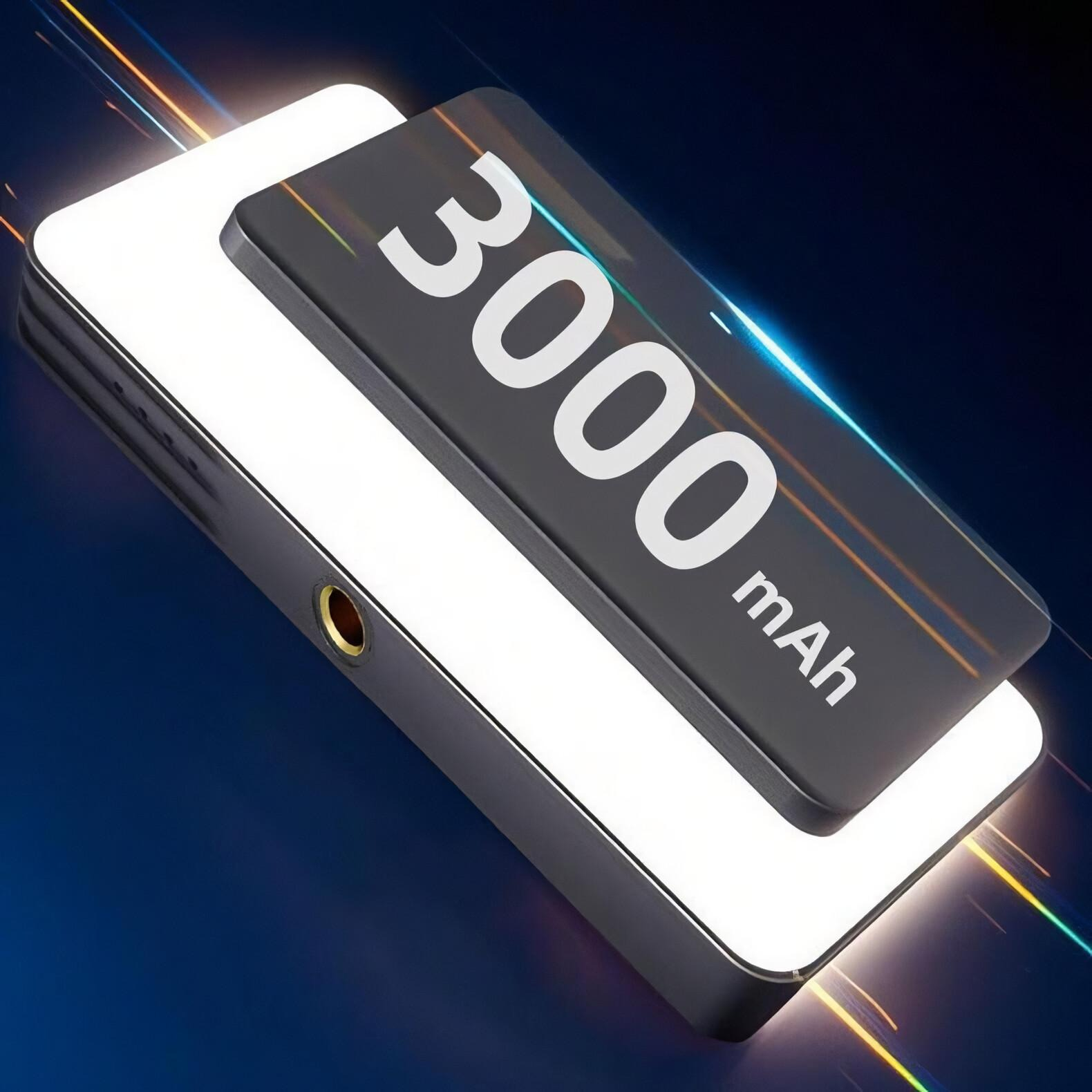 Ein schwarzes Gerät mit der Aufschrift '3000 mAh'. Es hat ein weißes Licht und ein goldenes Loch, vor blauem Hintergrund.