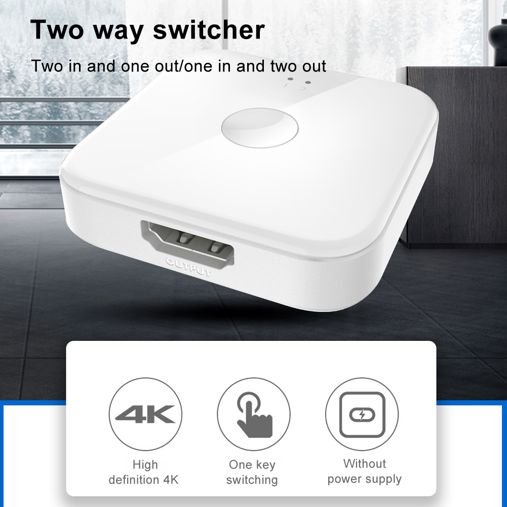 Ein weißer Zwei-Wege-Umschalter mit HDMI-Ausgang liegt auf einer Oberfläche. Symbole darunter zeigen 4K, One-Key-Switching und keine Stromversorgung.