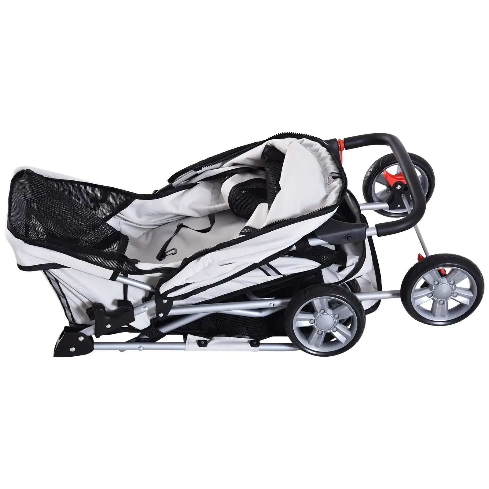 Ein weiß-schwarzer Tierkinderwagen steht vor weißem Hintergrund. Der Wagen hat Räder, Griffe und ein Netz.
