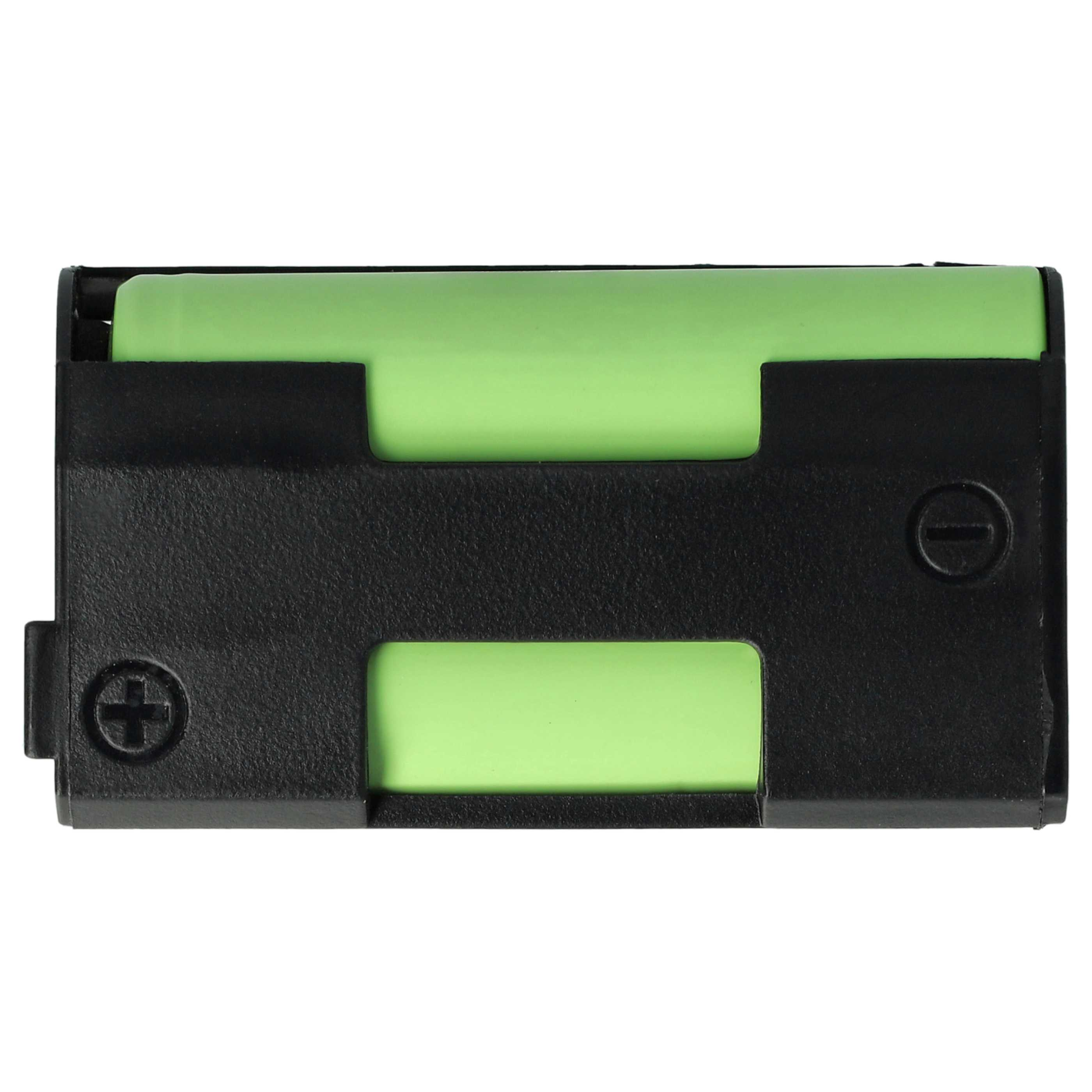 Ein schwarzer Batteriehalter mit einer grünen Batterie. Positive und negative Symbole sind sichtbar.