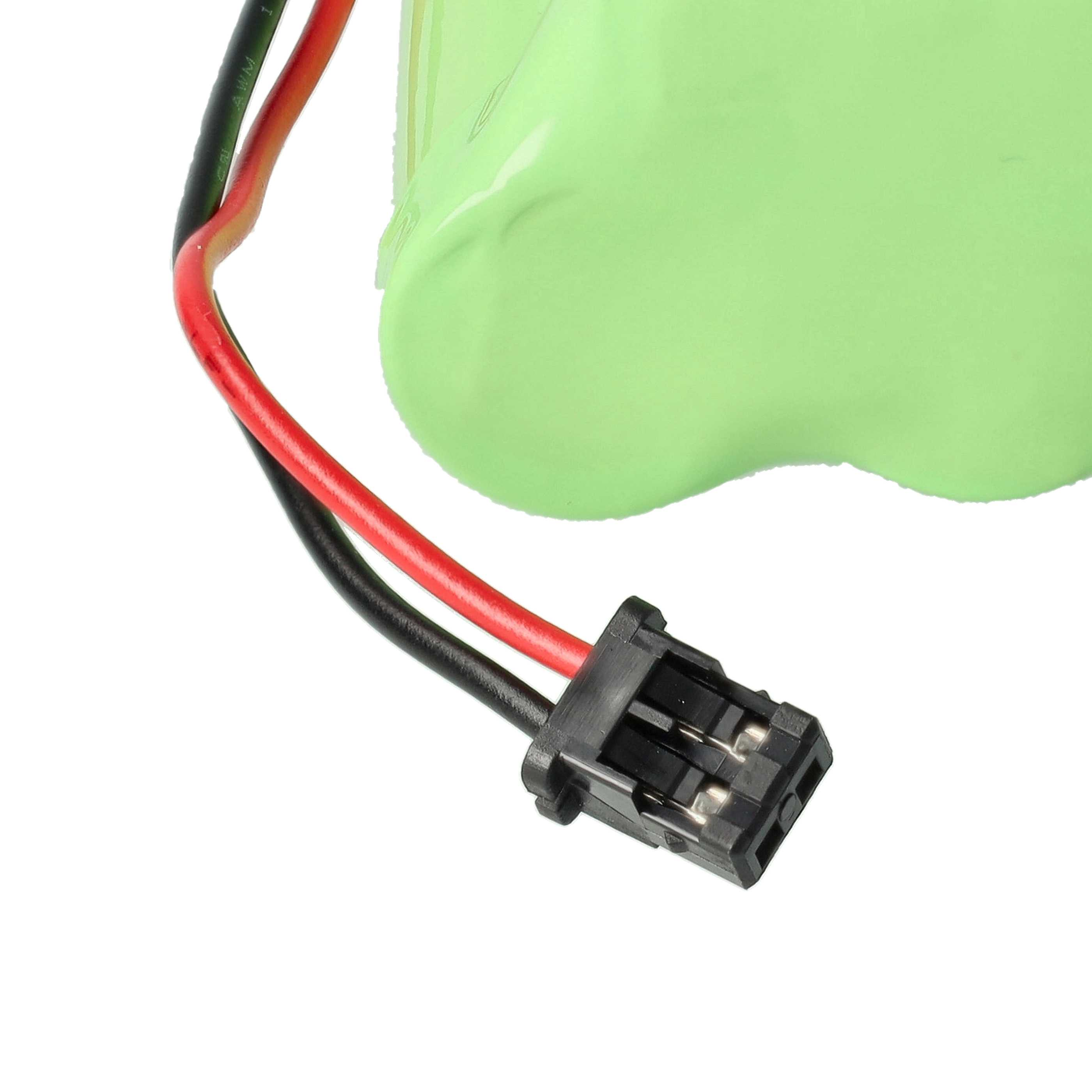Ein Akkupack mit grünem Deckel und roten und schwarzen Drähten, die an einen schwarzen Stecker angeschlossen sind.
