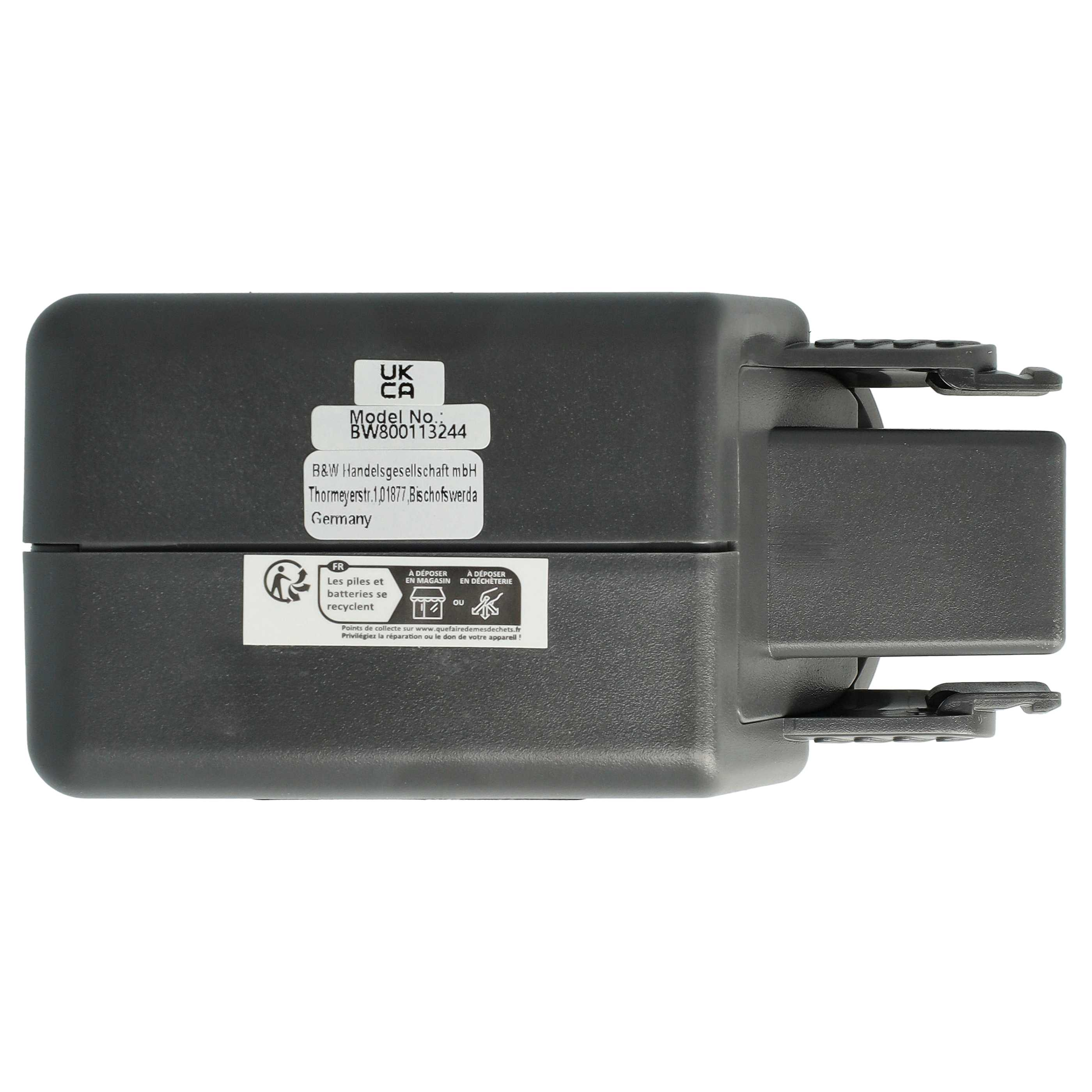 Ein dunkelgraues elektronisches Gerät mit Etiketten. Eines zeigt 'UK CA'. Andere haben Text und Symbole.