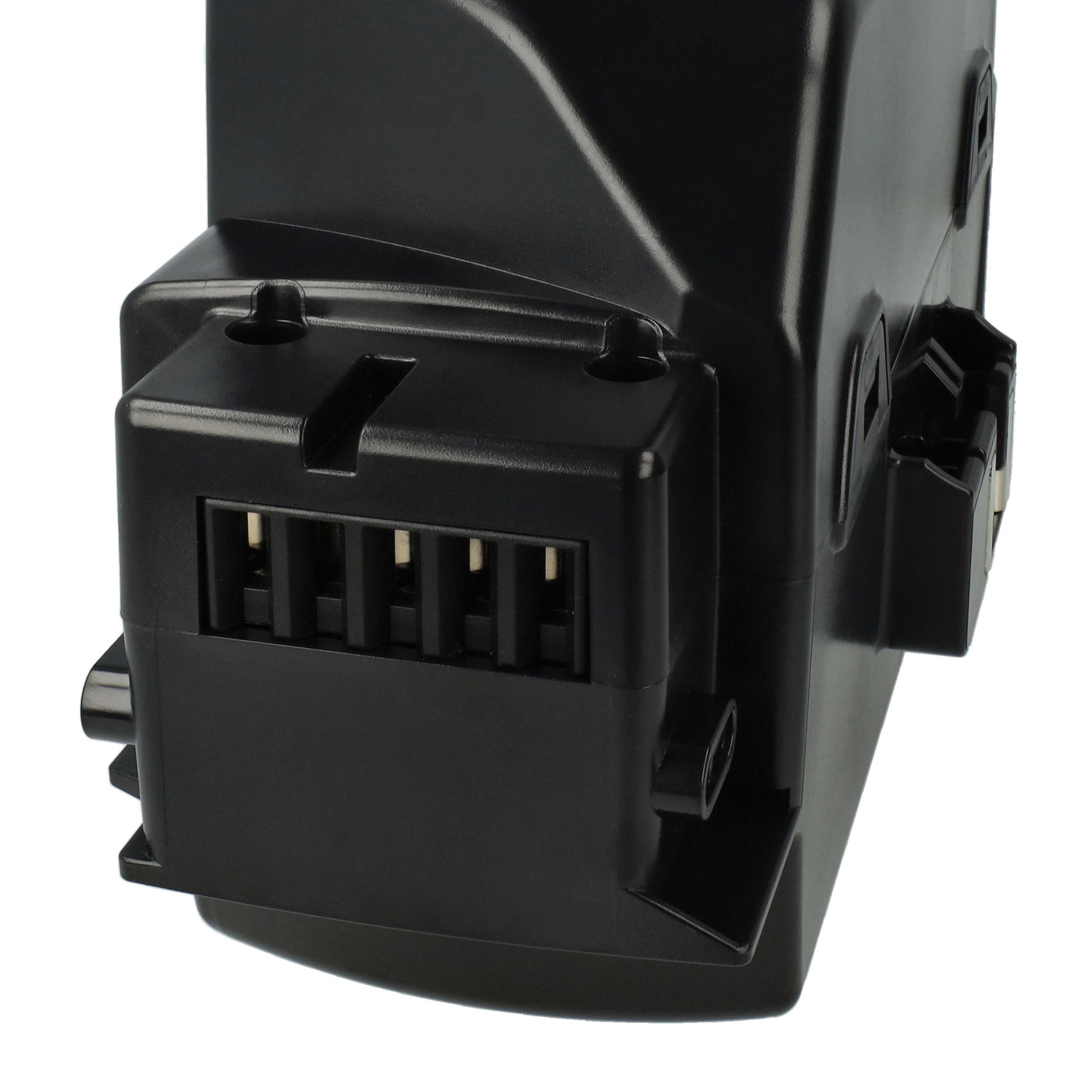 Nahaufnahme einer schwarzen elektrischen Komponente mit mehreren Steckstiften und einer kastenförmigen Form, vor weißem Hintergrund.