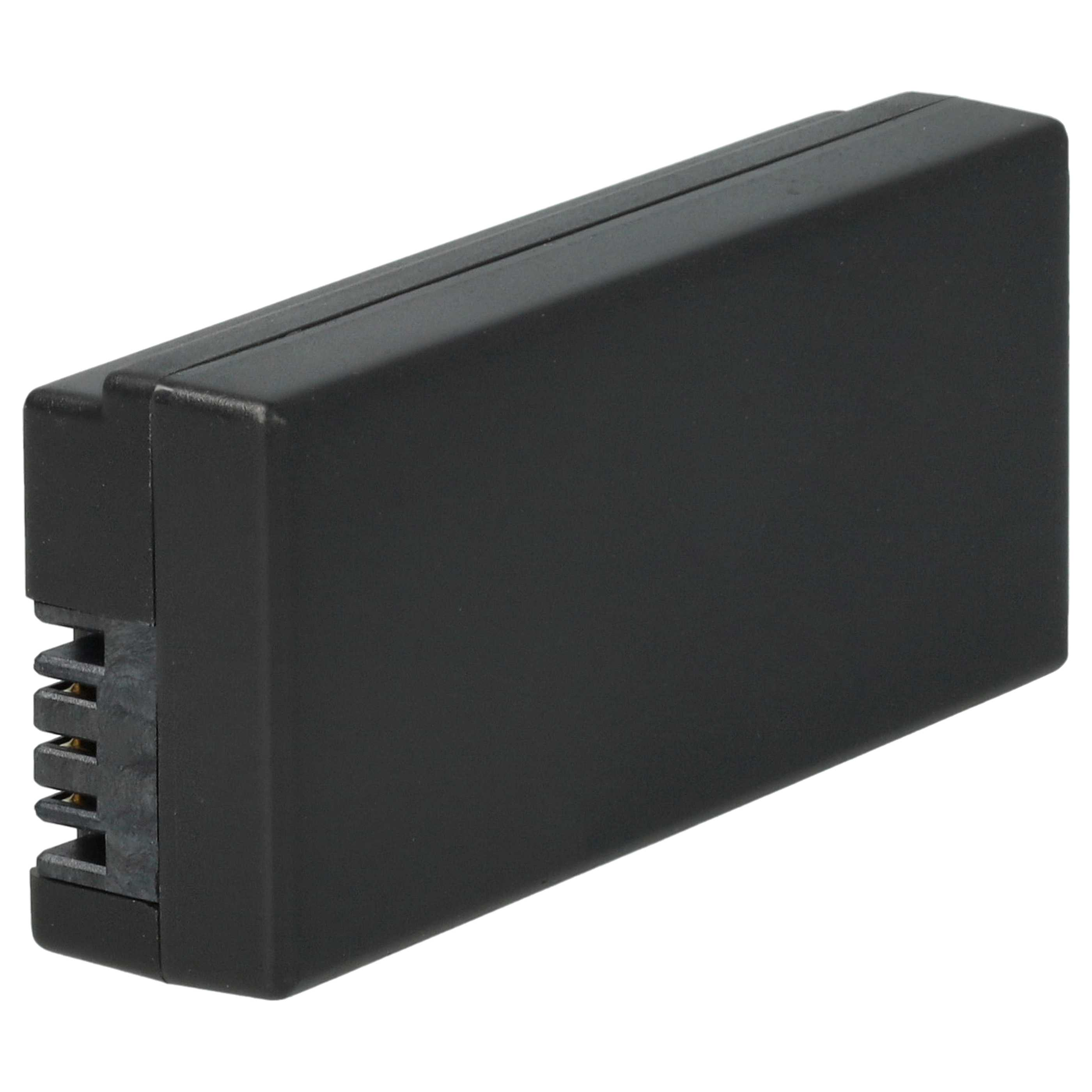 Ein schwarzes rechteckiges Objekt, möglicherweise ein Akku. Es hat an einem Ende einen Stecker mit goldfarbenen Stiften.