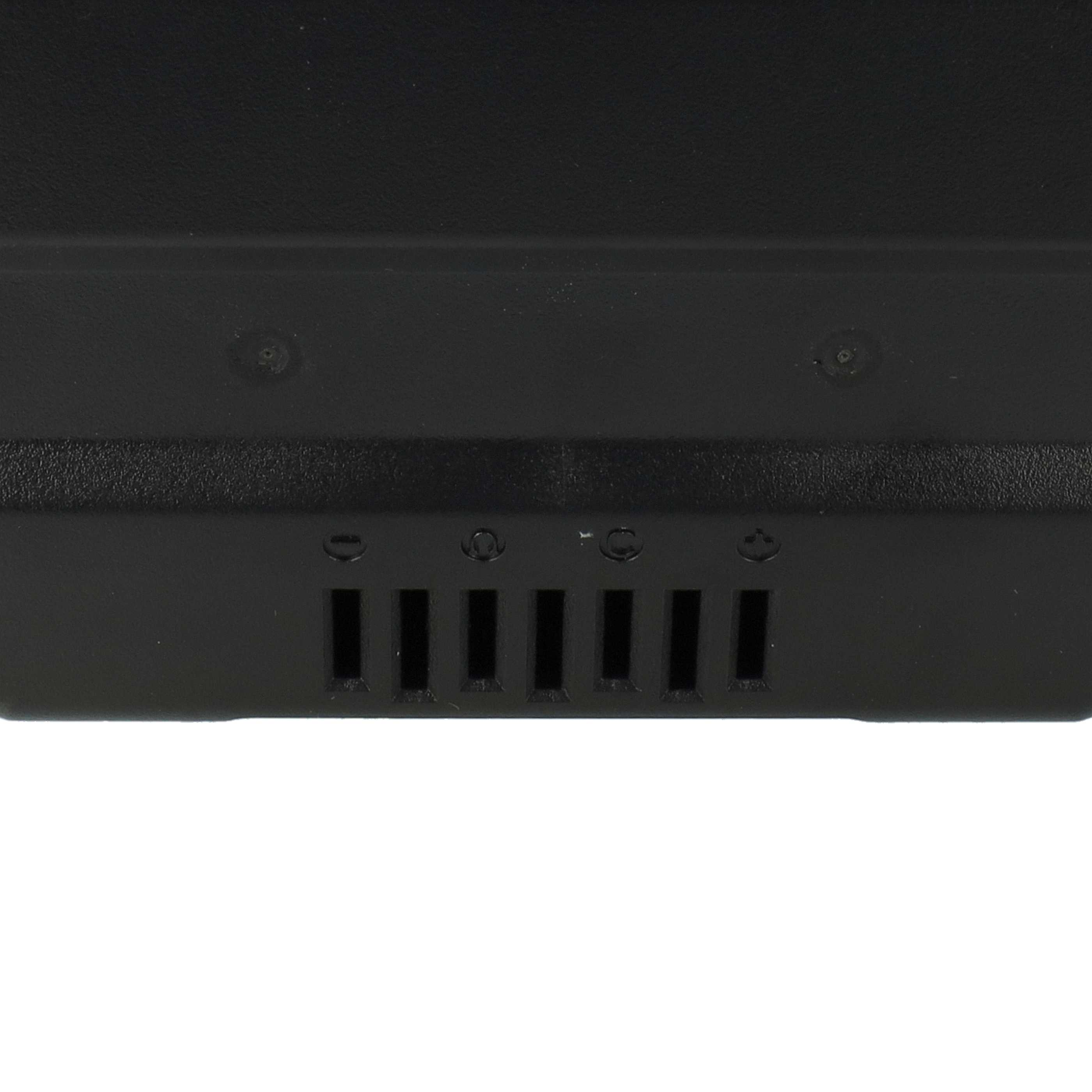 Nahaufnahme eines schwarzen elektronischen Geräts mit Lüftungsschlitzen und kleinen Löchern. Weißer Hintergrund.