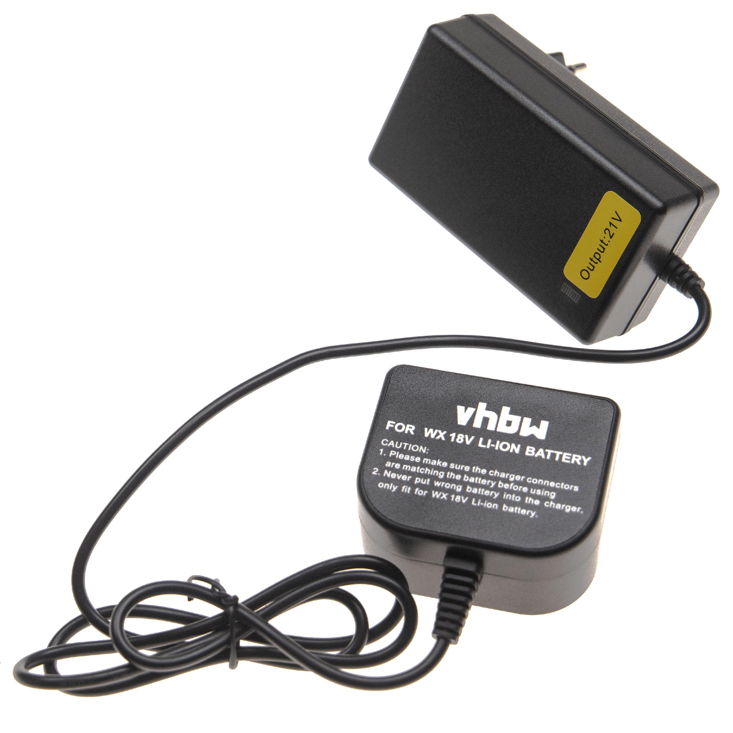 Ein schwarzes Ladegerät mit Kabel und der Aufschrift 'Output: 21V'. Eine kleinere schwarze Komponente ist ebenfalls sichtbar.