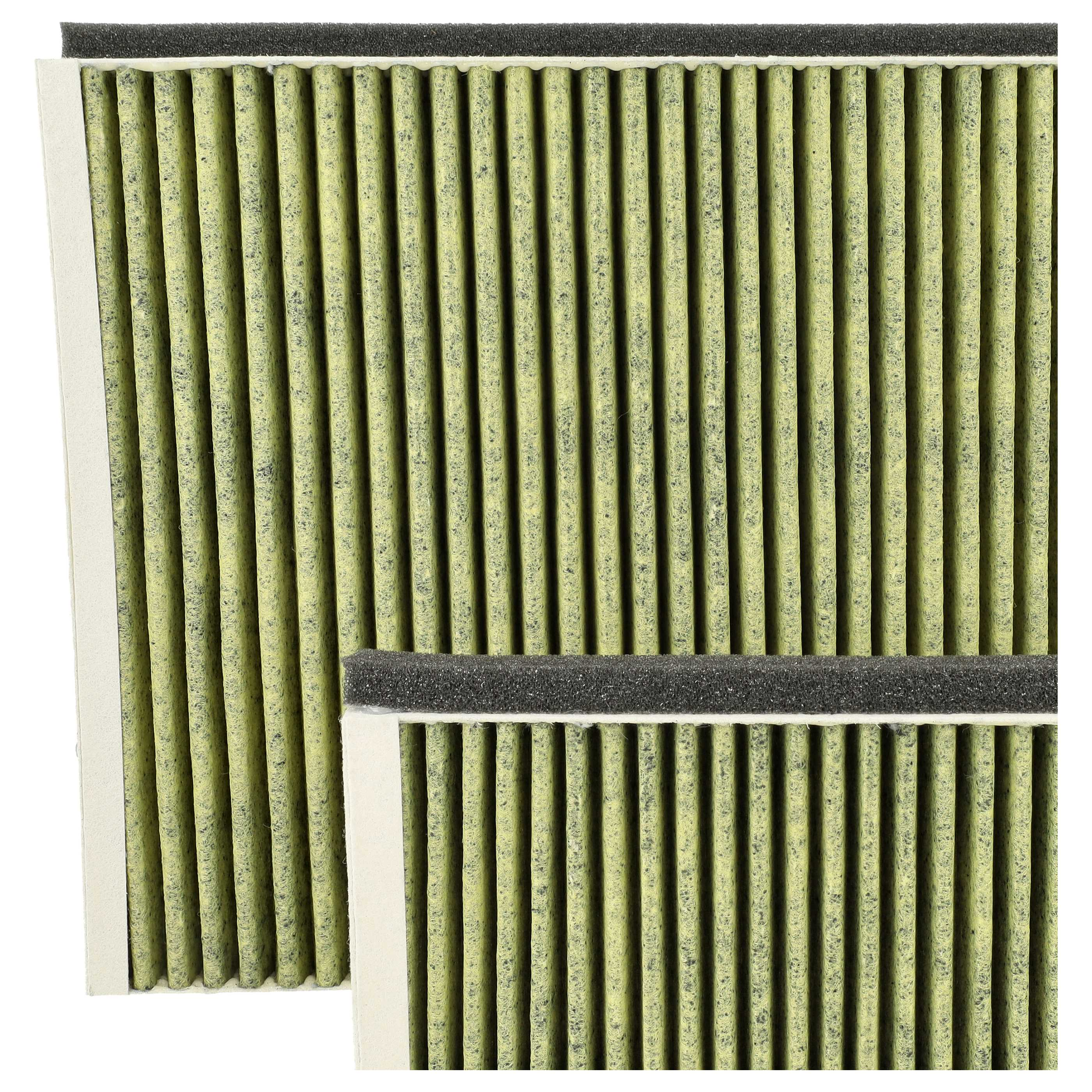 Zwei Luftfilterelemente, grün und beige, mit schwarzem Schaumstoffrand.