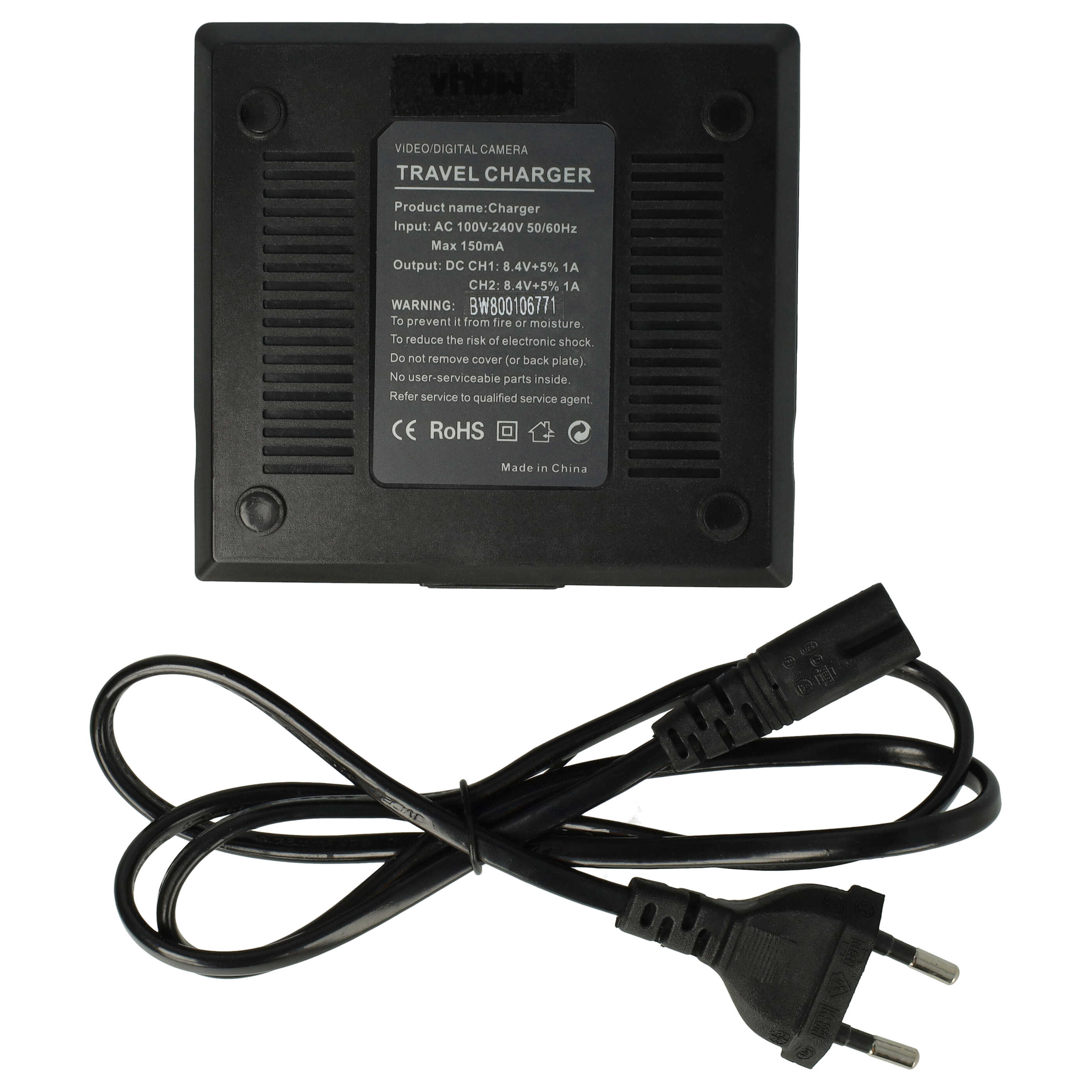 Ein schwarzes Reisegerät mit Netzkabel ist abgebildet. Es hat Textbeschriftungen und einen Stecker.