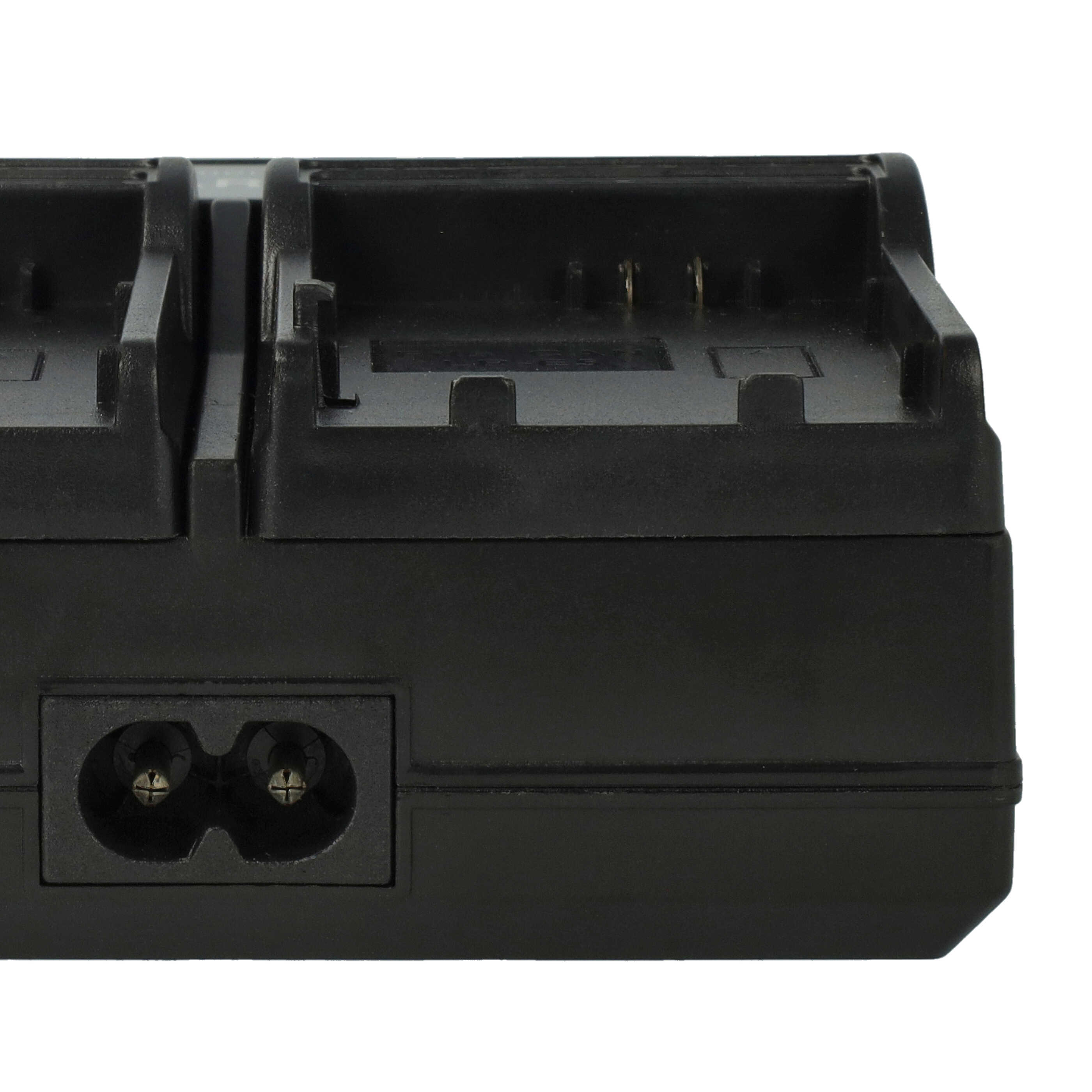 Ein schwarzes Akkuladegerät. Es hat Steckplätze für Batterien und einen Stromeingang.