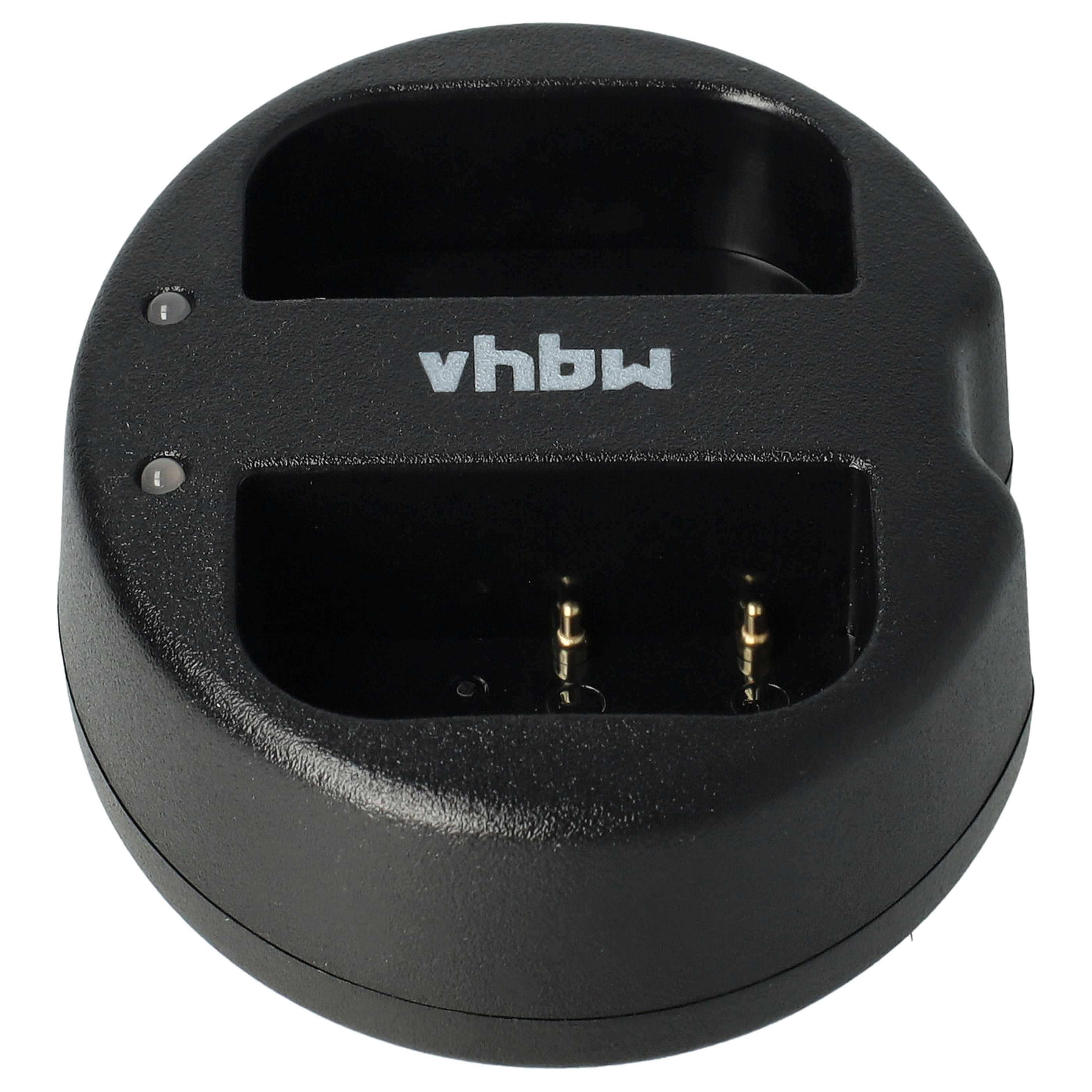 Schwarzes, kreisförmiges Ladegerät mit zwei Ladeschlitzen. Der Markenname 'vhbw' ist sichtbar. Zwei kleine Lichter sind vorhanden.