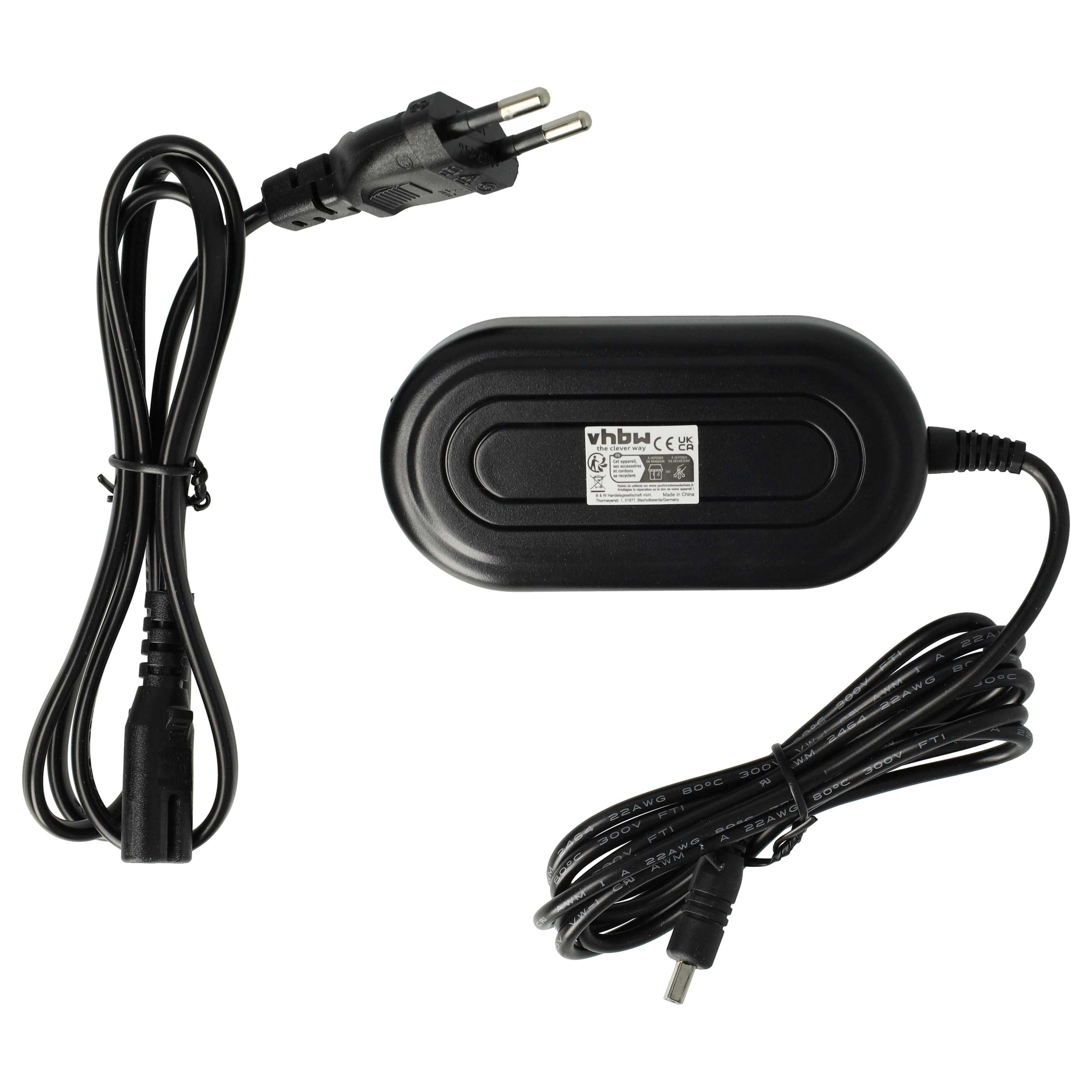 Ein schwarzes Netzteil mit Kabeln und einem Stecker. Der Adapter ist oval. Kabel sind schwarz.
