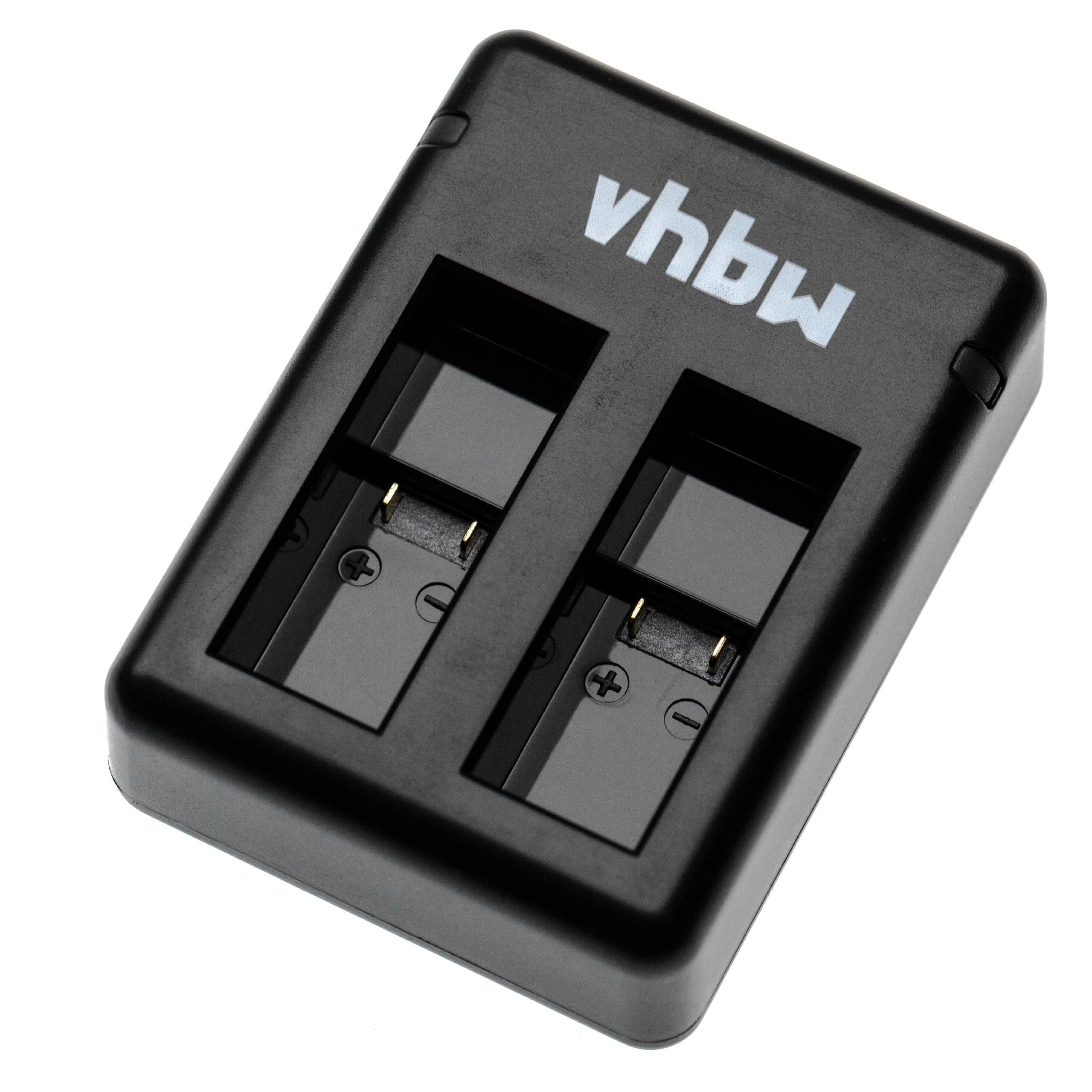 Schwarzes Batterieladegerät mit zwei Schlitzen, der Markenname vhbw ist oben aufgedruckt. Plus- und Minuszeichen sind sichtbar.
