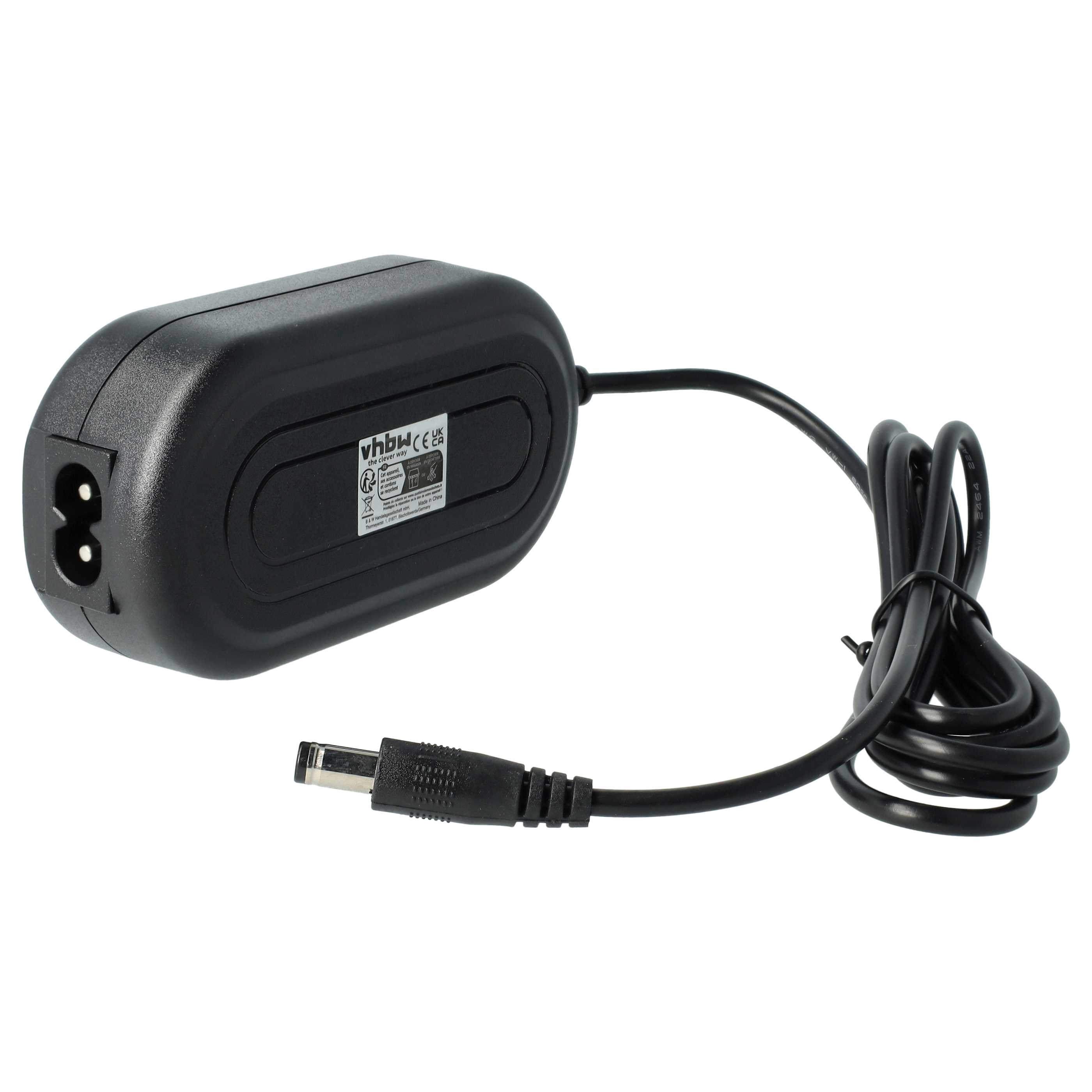 Schwarzes Netzteil mit Kabel und DC-Anschluss. Der Adapter hat ein Etikett mit Text und einen Stromeingangsanschluss.