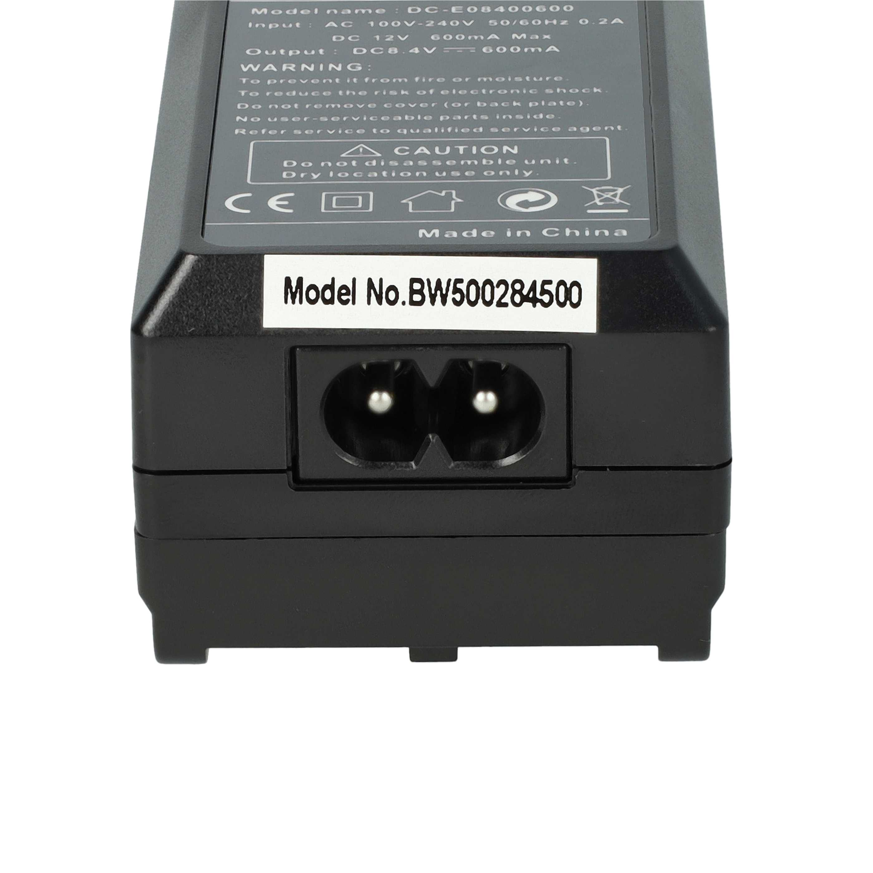 Schwarzer Netzadapter. Text enthält Modell- und Warnhinweise. Unten befindet sich ein Stromeingangsanschluss.
