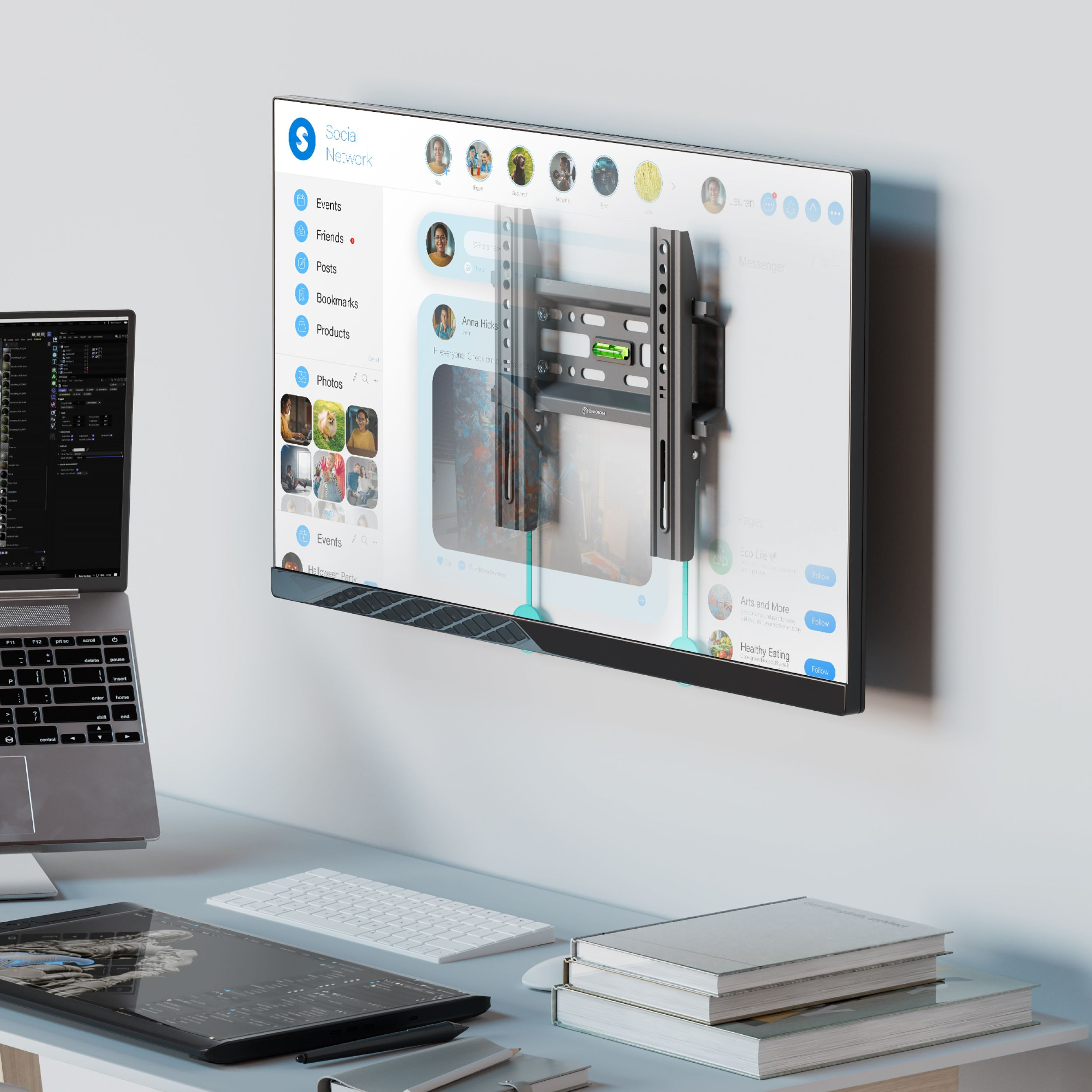 Telewizor na ścianie wyświetla interfejs sieci społecznościowej. Laptop, tablet, klawiatura i książki są na biurku.