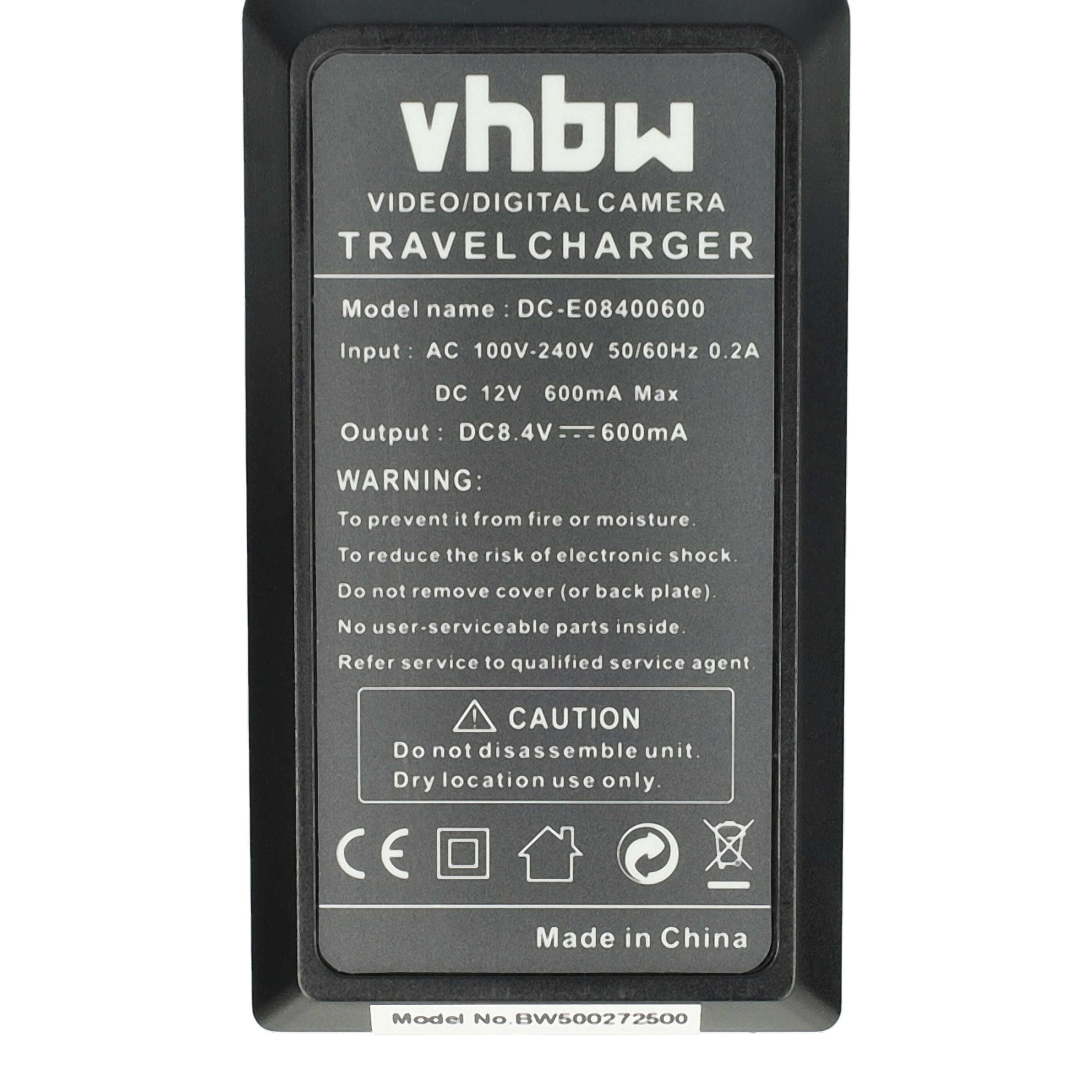 Ein schwarzes Reisegerät mit weißem Text. Es steht 'vhbw', 'Travel Charger' drauf, sowie Warnungen und technische Daten.