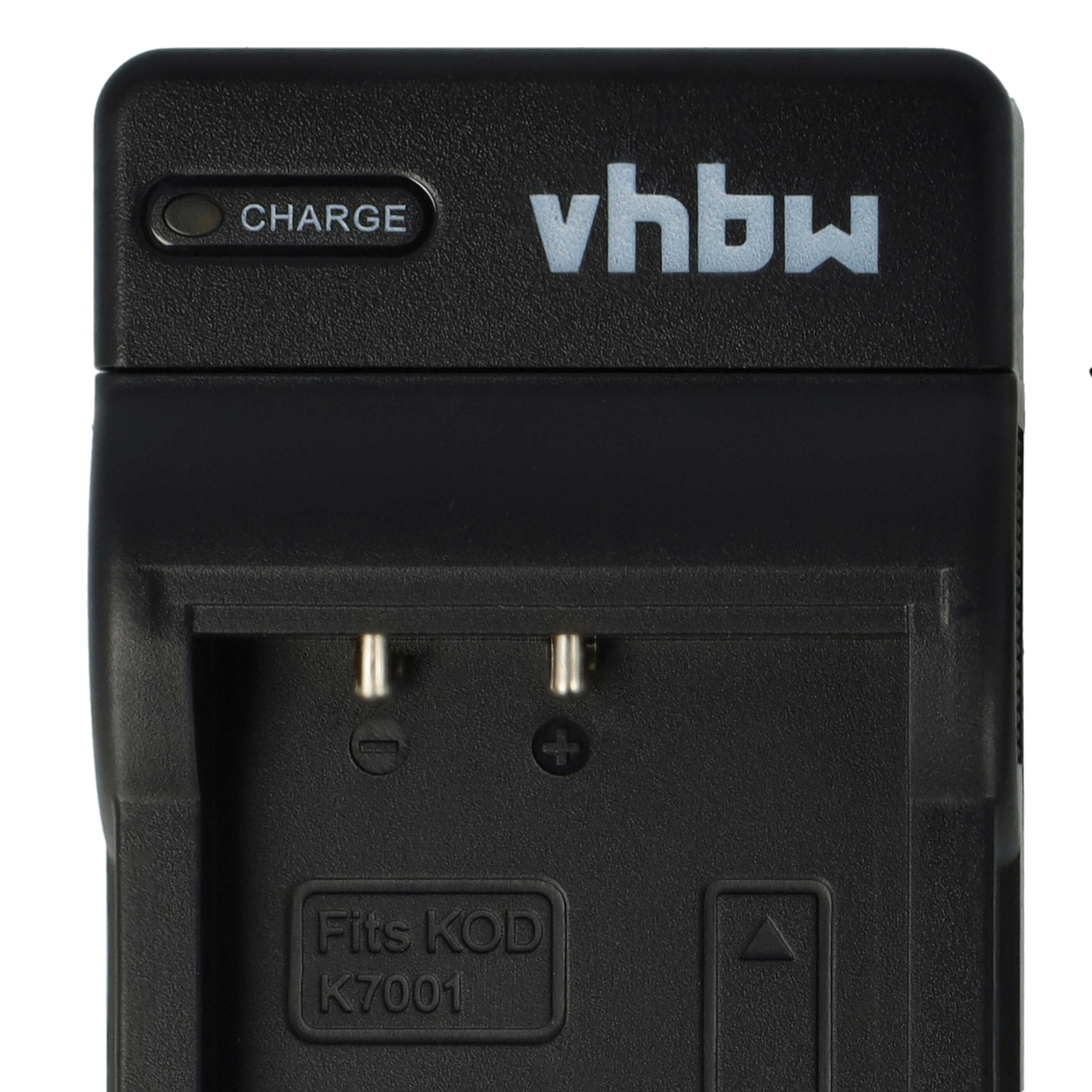 Schwarzes Batterieladegerät mit "vhbw" und "CHARGE" Beschriftung. Es hat zwei Metallstifte und die Aufschrift "Fits KOD K7001".