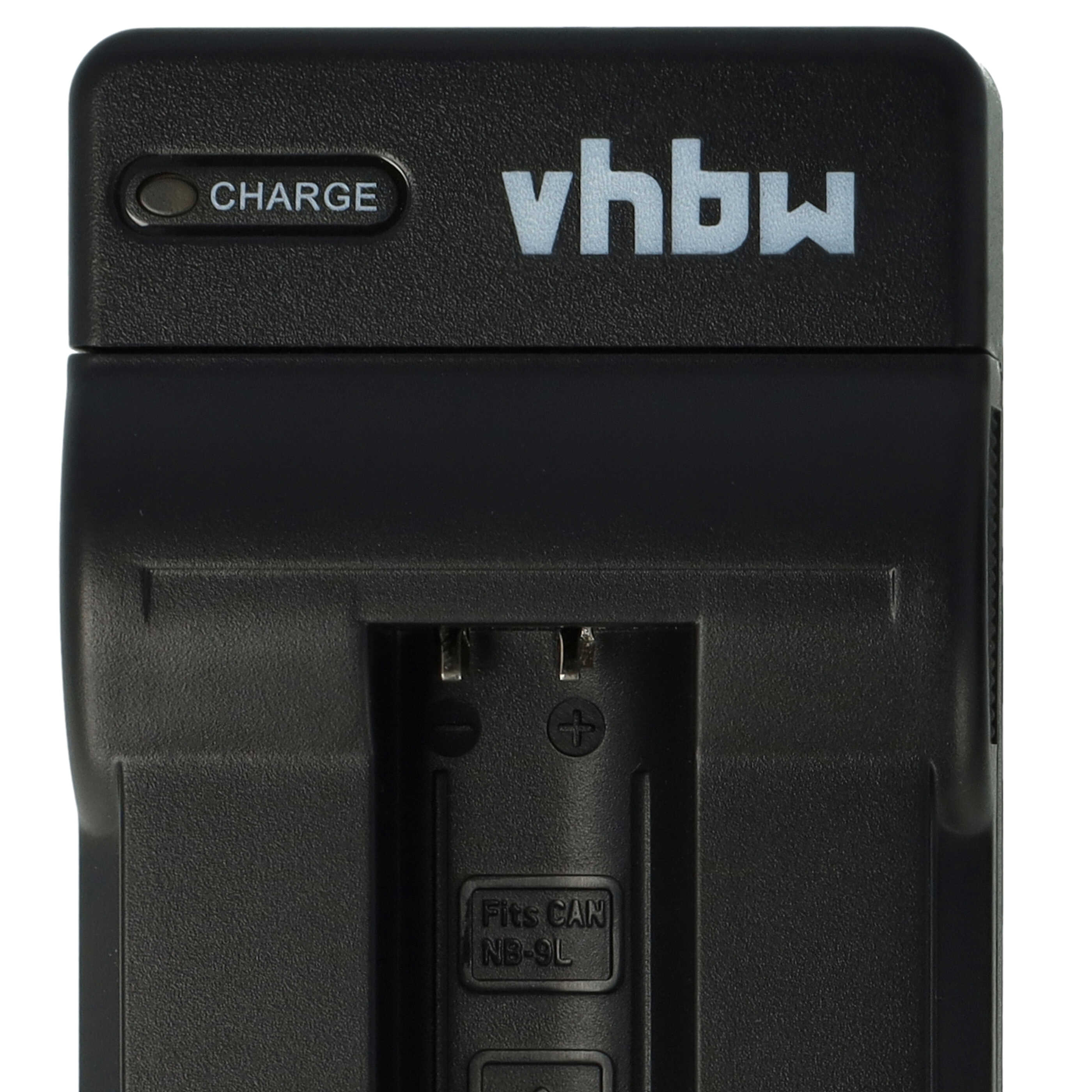 Schwarzes vhbw-Batterieladegerät. Es trägt die Aufschrift 'CHARGE' und den Text 'Fits CAN NB-9L'. Zeigt Plus- und Minuszeichen.