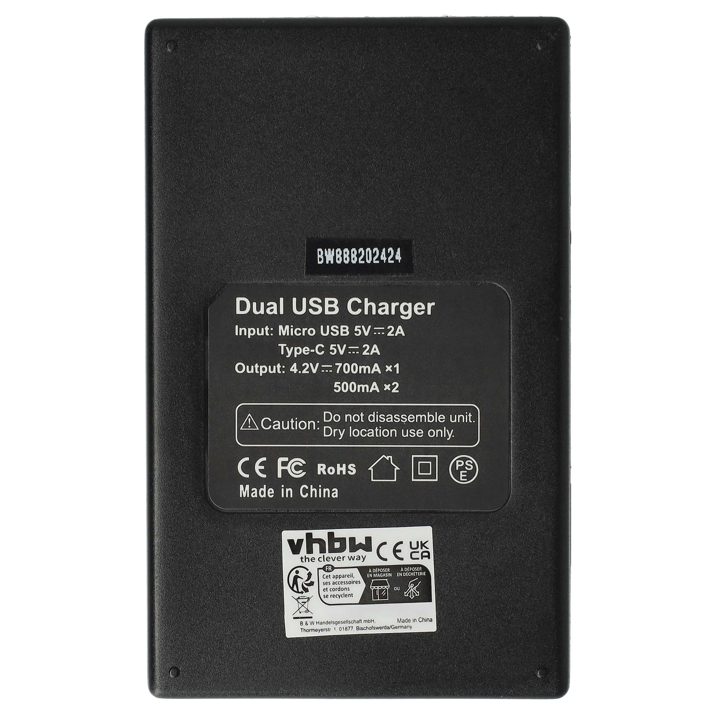Schwarzes Dual-USB-Ladegerät mit Text: Dual USB Charger, Eingangsdetails, Vorsichtshinweis und Zulassungszeichen.