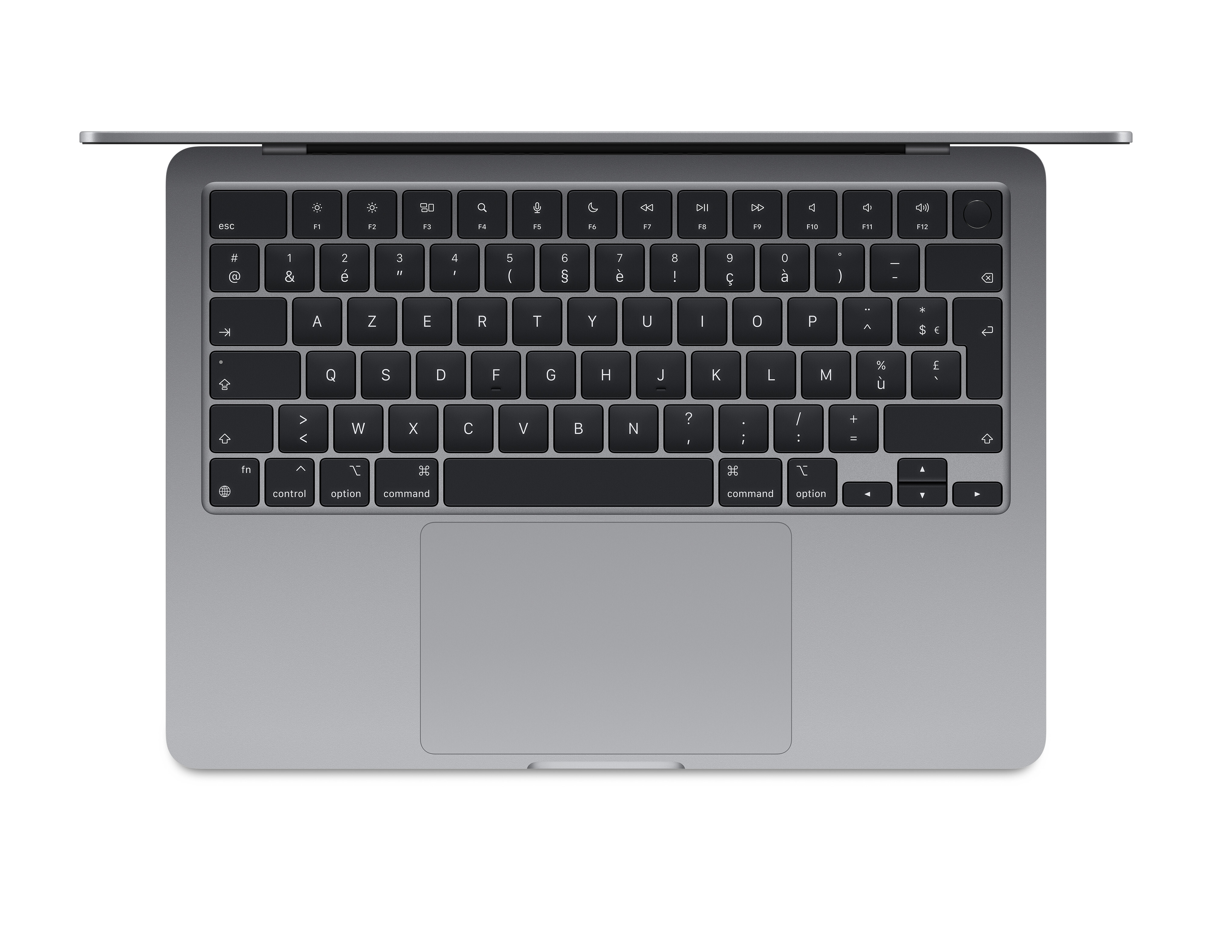 Srebrny laptop z czarnymi klawiszami jest otwarty. Klawiatura ma litery, cyfry i symbole.