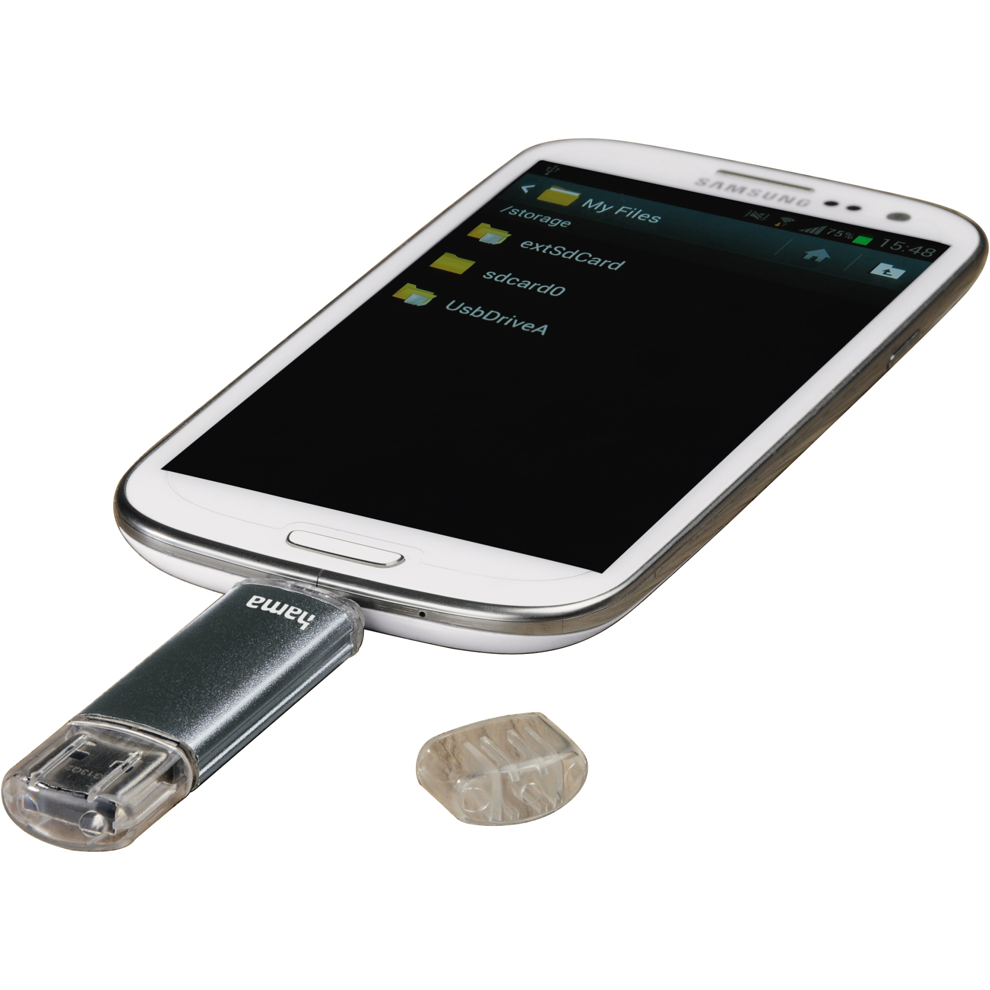 Ein weißes Samsung-Telefon ist mit einem silbernen USB-Laufwerk verbunden. Das Telefon zeigt Dateiverzeichnisse. Eine transparente Plastikkappe ist in der Nähe.