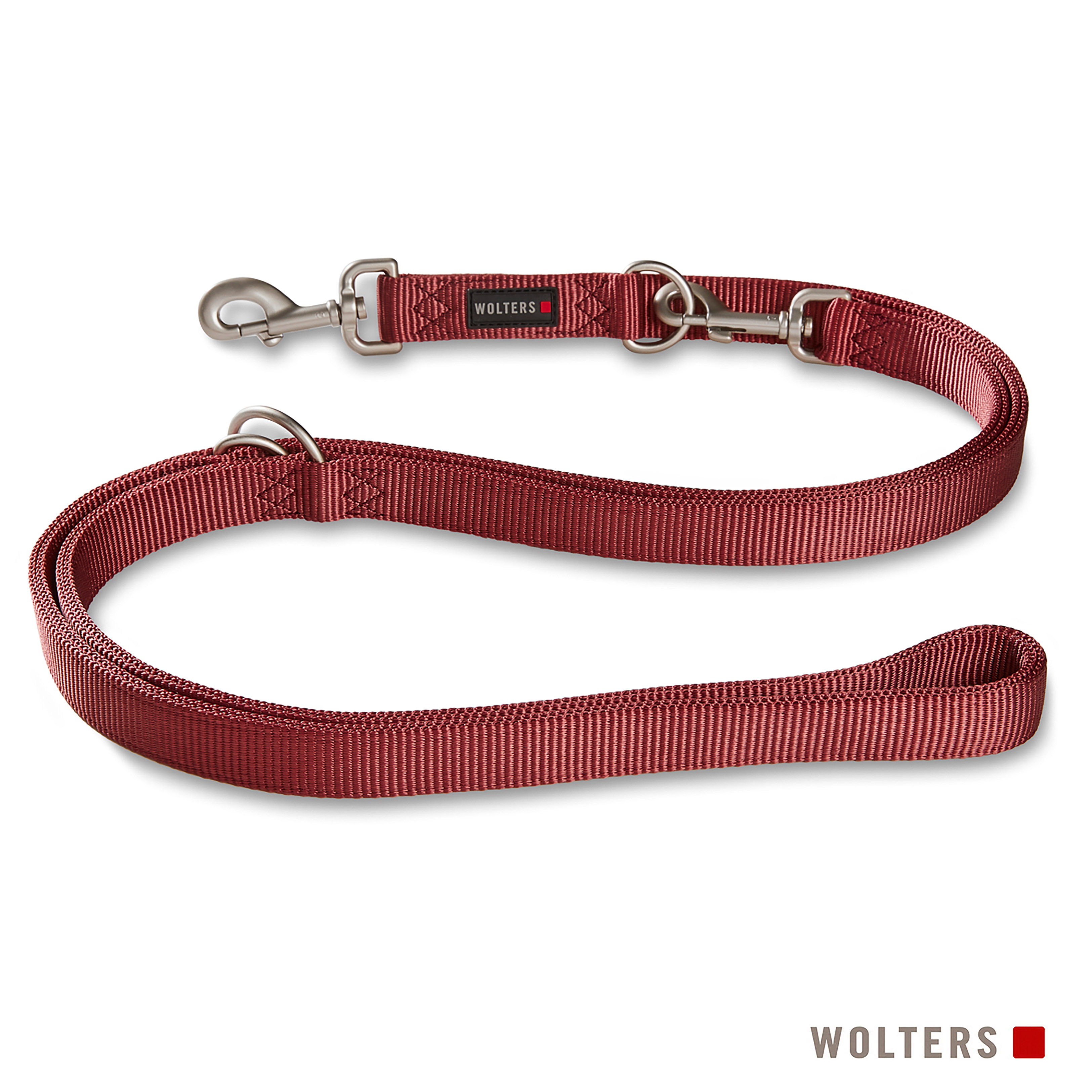 Eine rote Hundeleine mit Metallclips und Ringen. Der Markenname 'WOLTERS' ist aufgedruckt.
