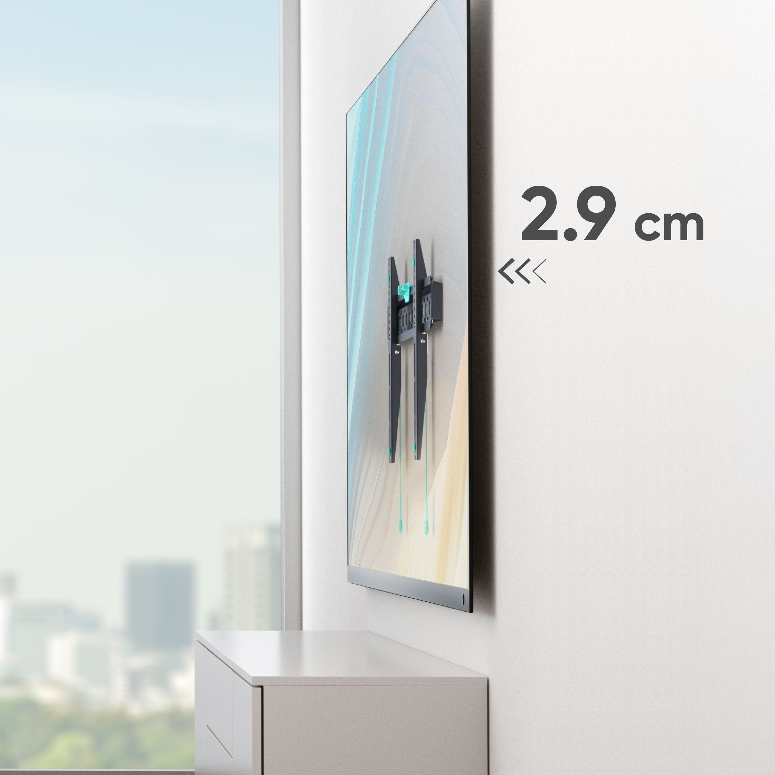 Telewizor zamontowany na białej ścianie. Szuflada poniżej. Tekst mówi 2,9 cm. Okno z widokiem na miasto.