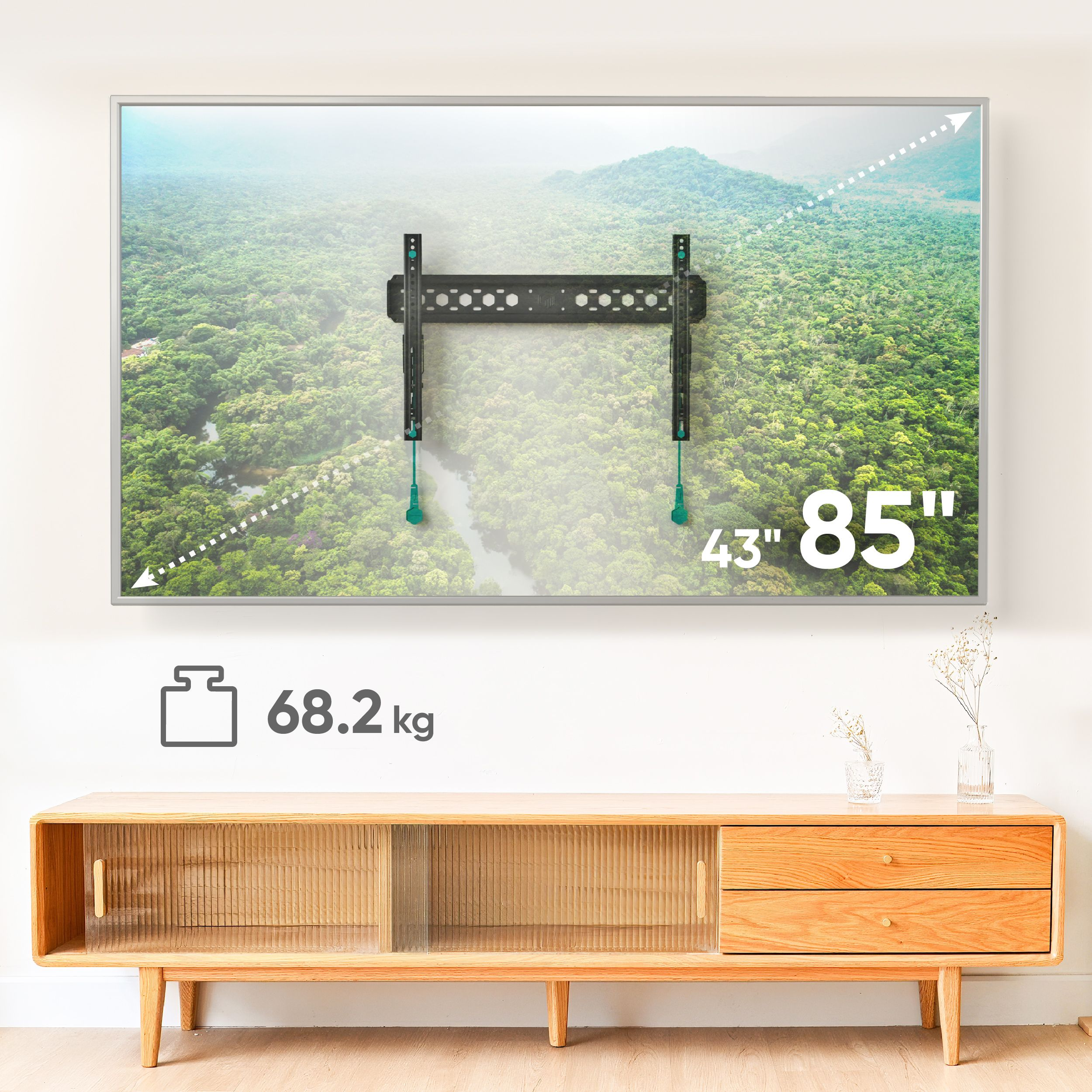 Telewizor zamontowany na ścianie, szafka z przodu. Telewizor wyświetla scenę leśną. Waga: 68,2 kg, rozmiar: 43" 85".