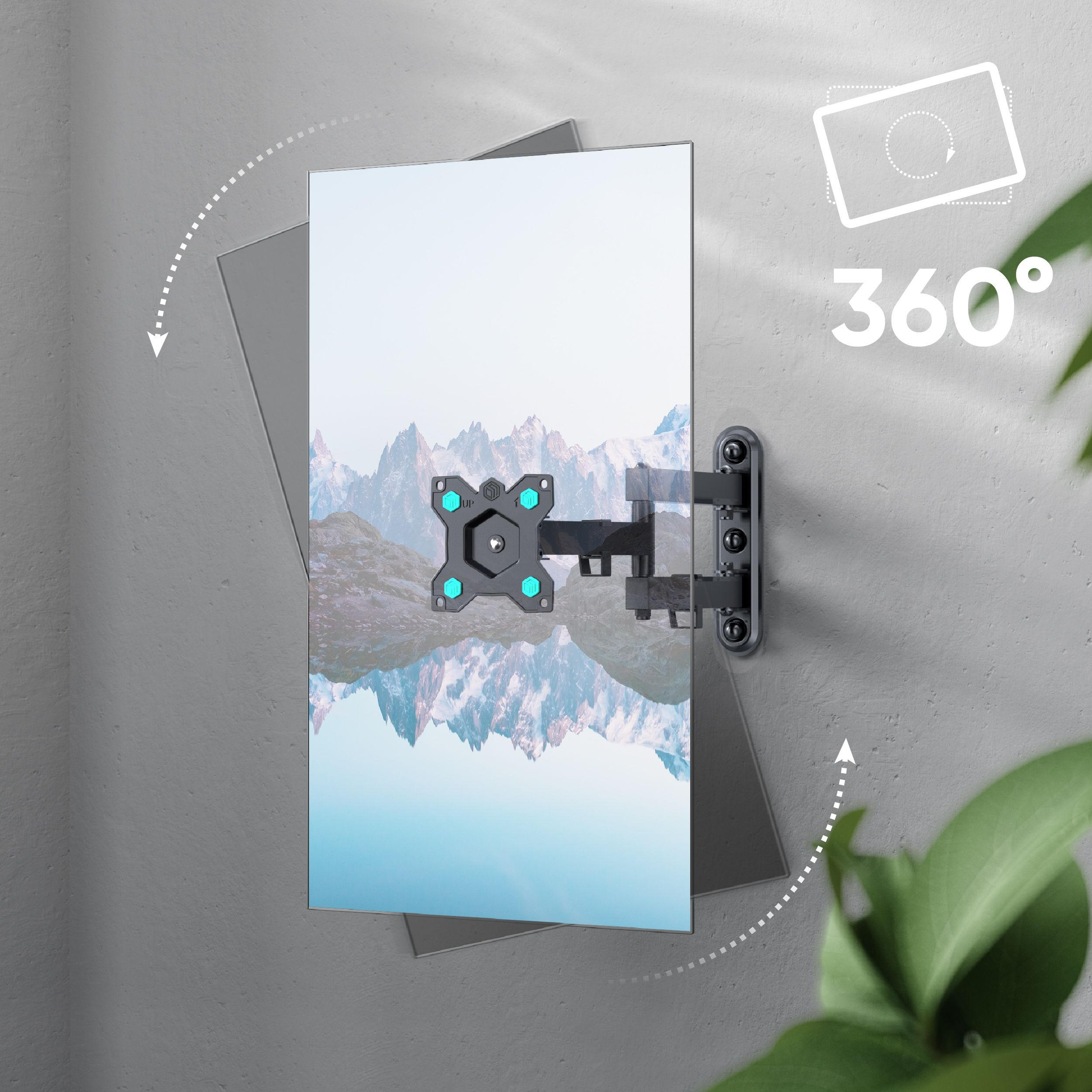 Ekran telewizora zamontowany na szarej ścianie, z funkcją obrotu 360 stopni. Ekran wyświetla krajobraz górski.