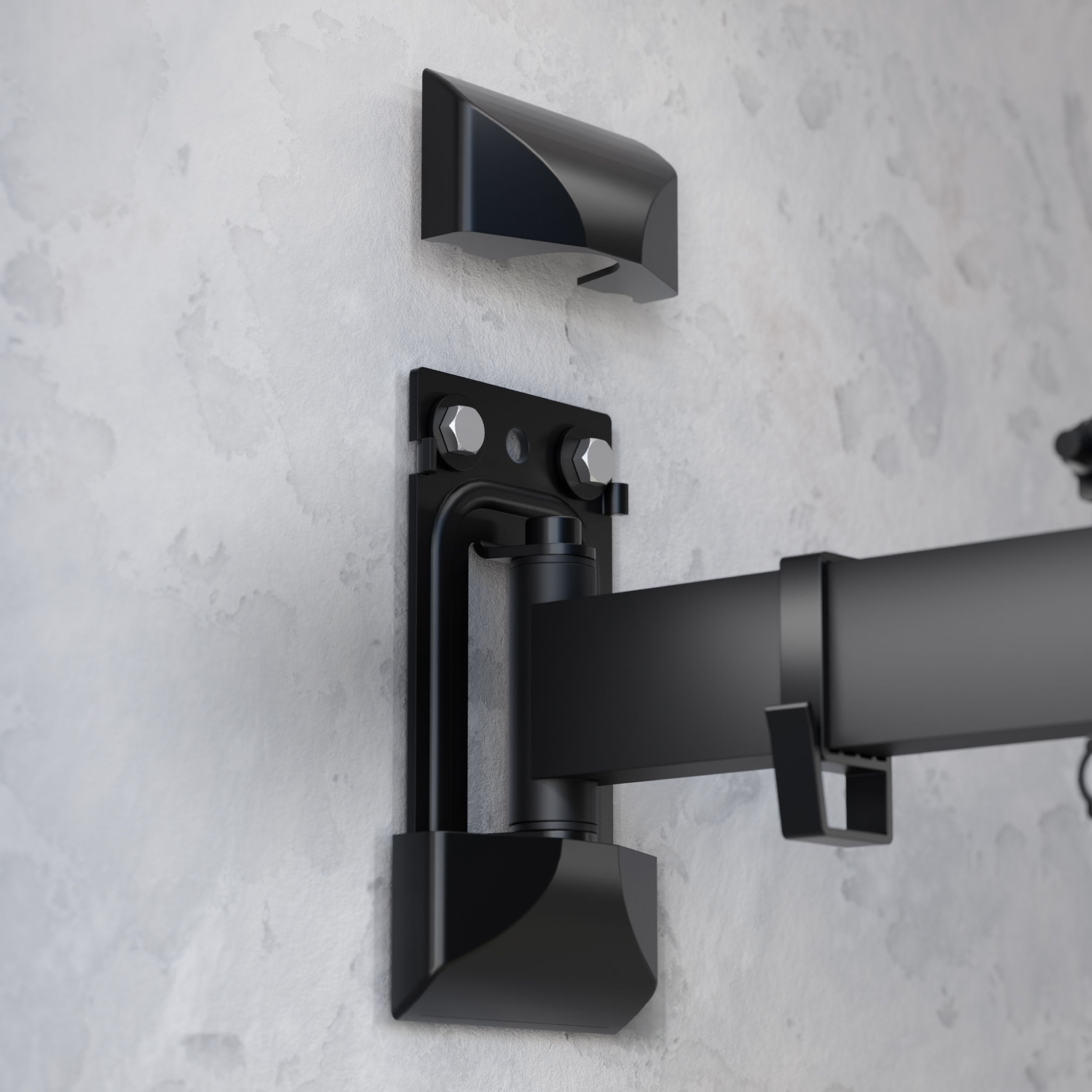 Czarny uchwyt ścienny do TV na szarej ścianie. Zawiera ramię przegubowe, płytę i osłonę.