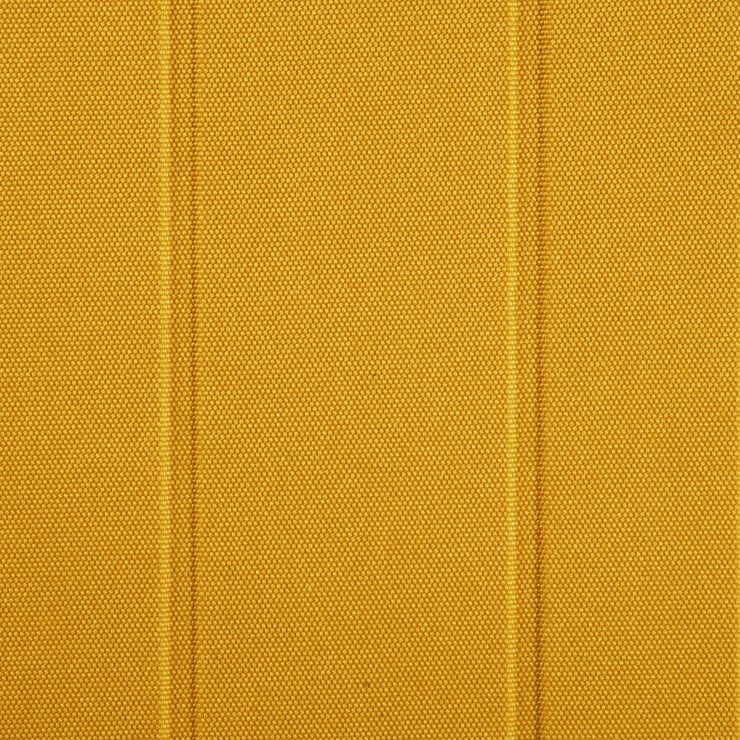 Zbliżenie na teksturowaną żółtą powierzchnię. Pionowe linie tworzą wzór. Materiał ma kropkowaną teksturę.