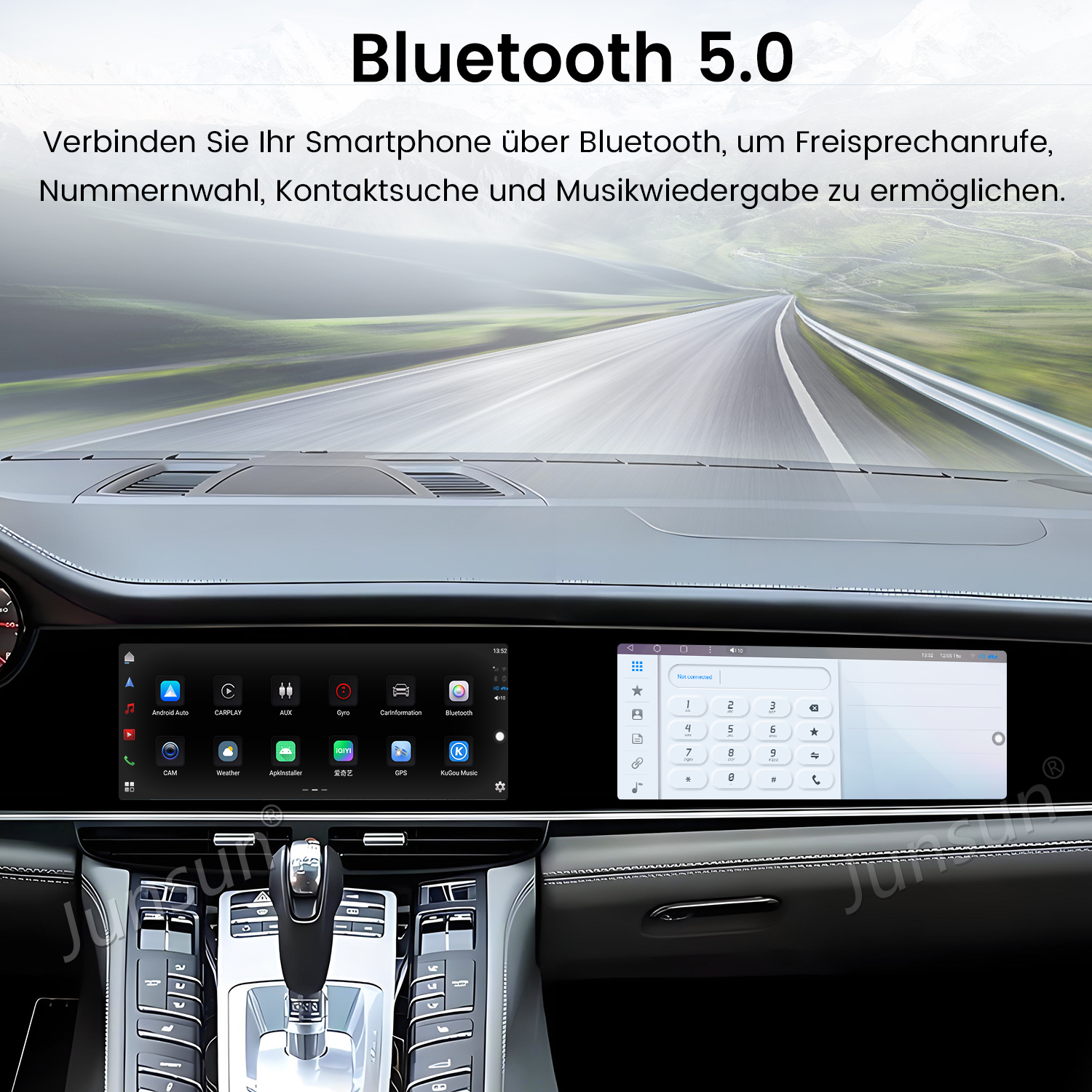 Deska rozdzielcza samochodu z ekranem pokazującym klawiaturę telefoniczną i ikony aplikacji. Widoczna droga przez przednią szybę, tekst Bluetooth 5.0.