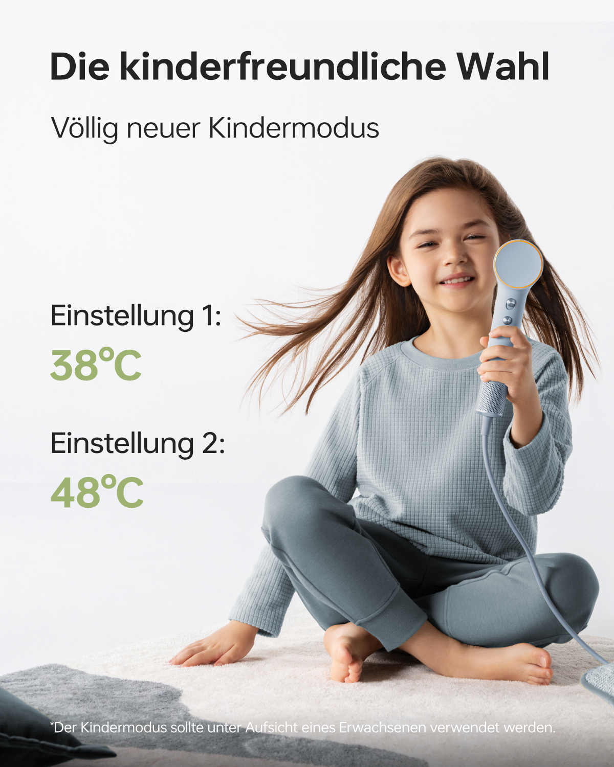 Gülümseyen bir kız mavi bir cihaz tutuyor. Metin 'Die kinderfreundliche Wahl' yazıyor. 1 ve 2 ayarları sıcaklıkları gösteriyor.