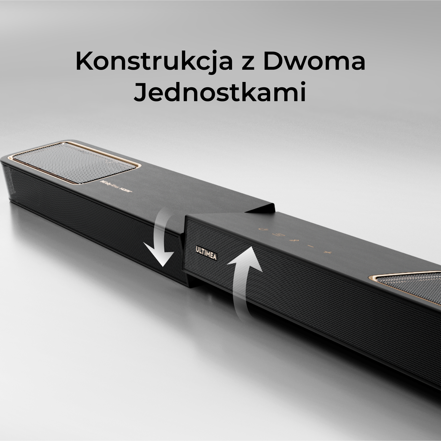 Czarny soundbar z siatkowym przodem dzieli się na dwie części. Strzałki wskazują podział. Tekst powyżej mówi: 'Budowa z dwoma jednostkami'.