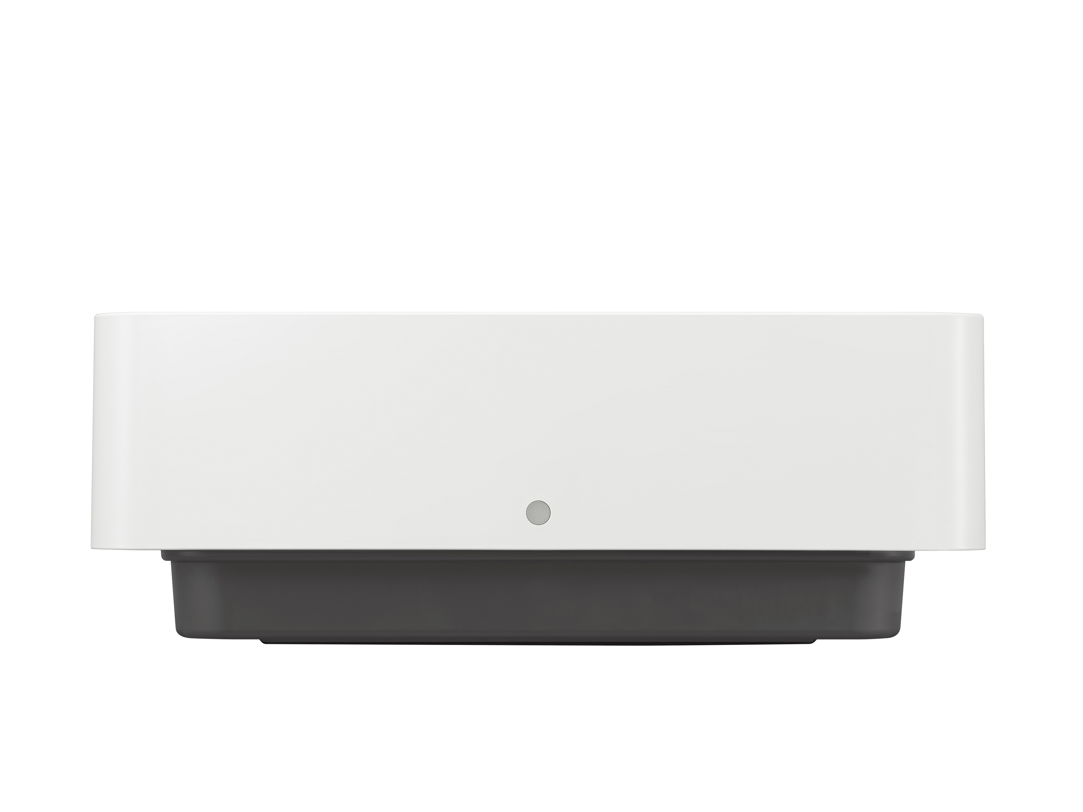 Un appareil rectangulaire blanc est posé sur une base gris foncé. Un petit détail circulaire est centré sur le devant.