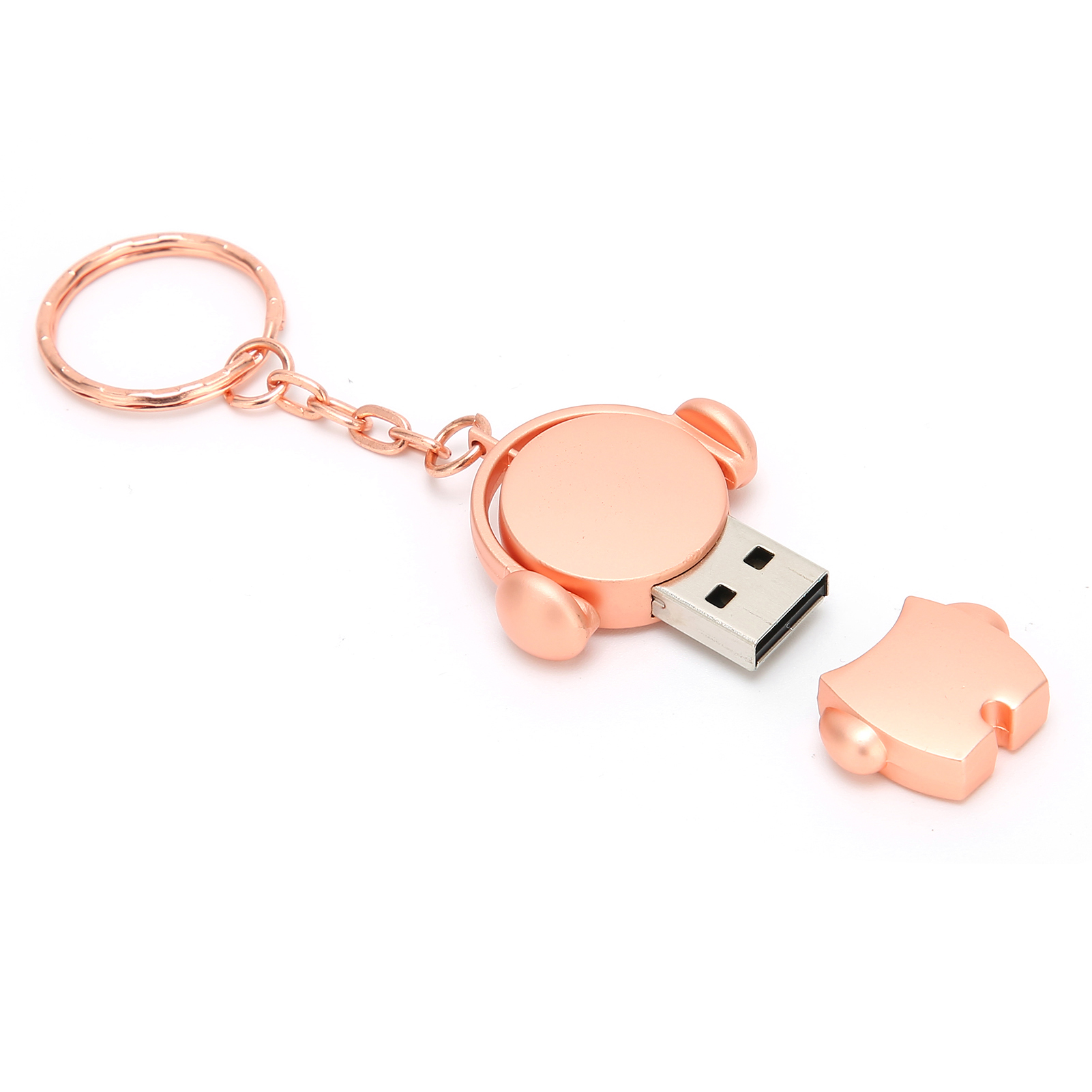 Ein kupferfarbener USB-Stick in Form eines Puzzleteils mit Schlüsselring. Die Kappe ist abgenommen.