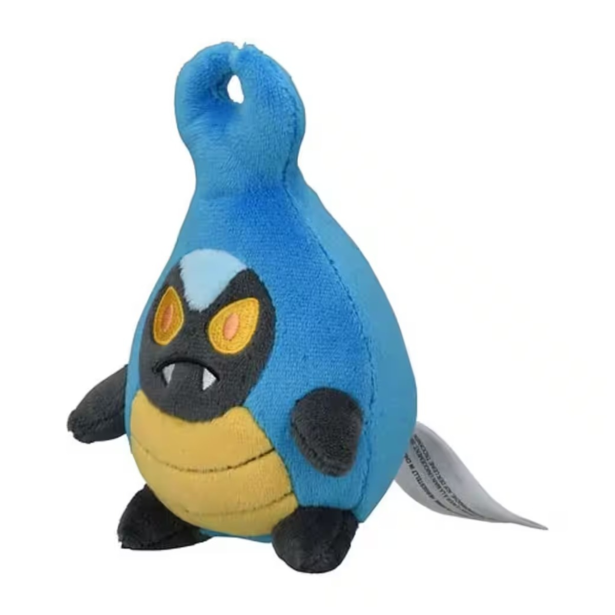 Blaues Plüschtier in Form eines Charakters mit schwarzem Gesicht, gelben Augen und gelbem Bauch. Es hat kleine Arme und Beine.
