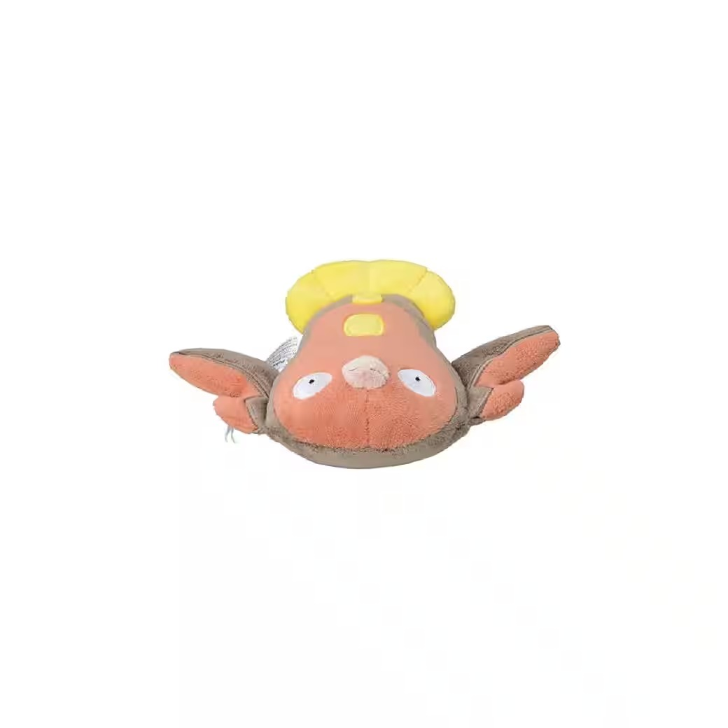 Ein Plüschtier, das einem Charakter mit pfirsichfarbenem Gesicht, braunen Flügeln und einem gelben Kopfschmuck ähnelt, vor weißem Hintergrund.
