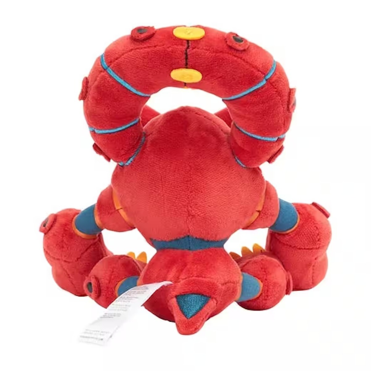 Ein rotes Plüschtier-Roboter mit blauen und gelben Akzenten und einem weißen Etikett. Der Roboter ist von hinten zu sehen, mit einer großen haloartigen Struktur.