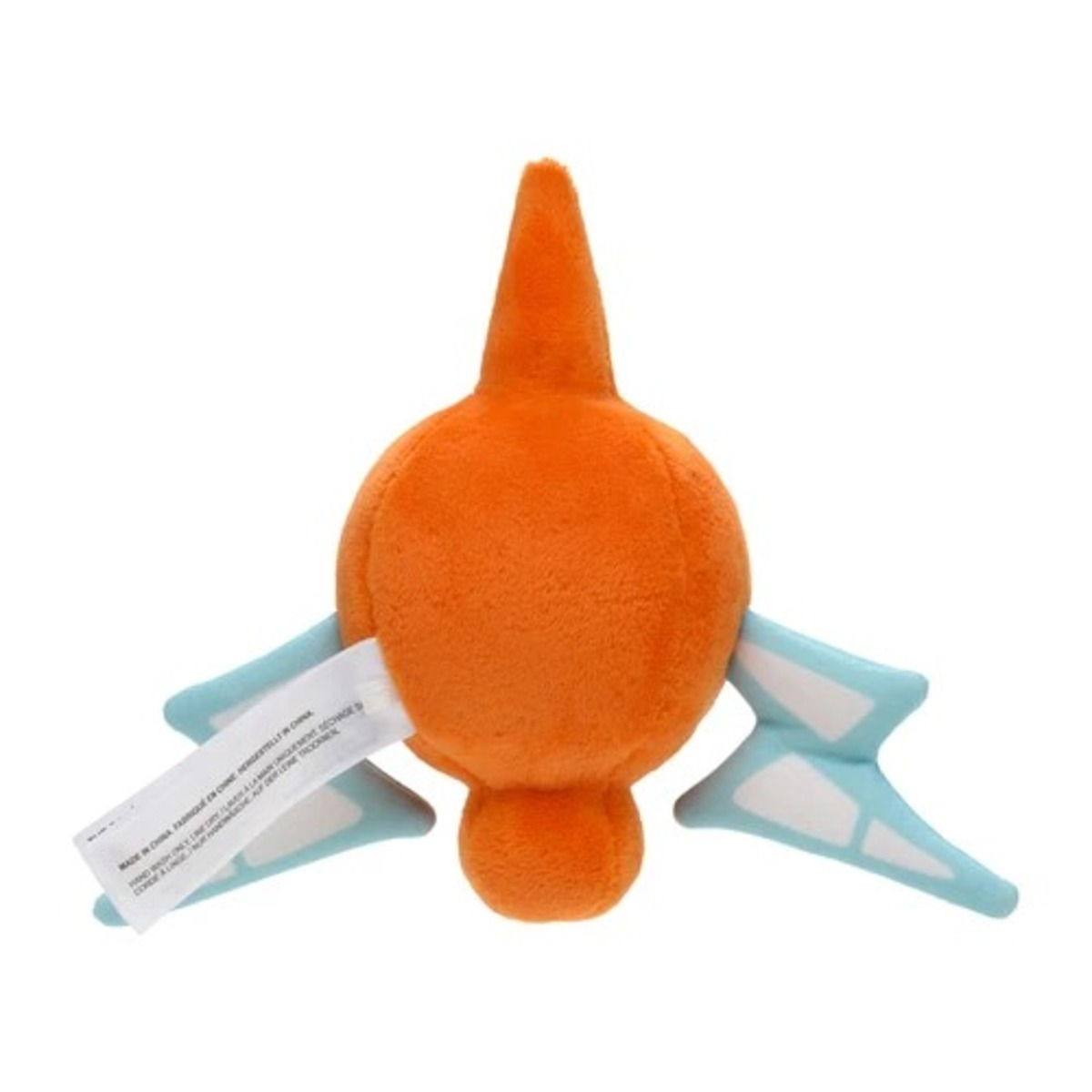 Ein orangefarbenes Plüschtier mit blauen Flügeln. Es hat ein weißes Etikett. Der Hintergrund ist schlicht weiß.
