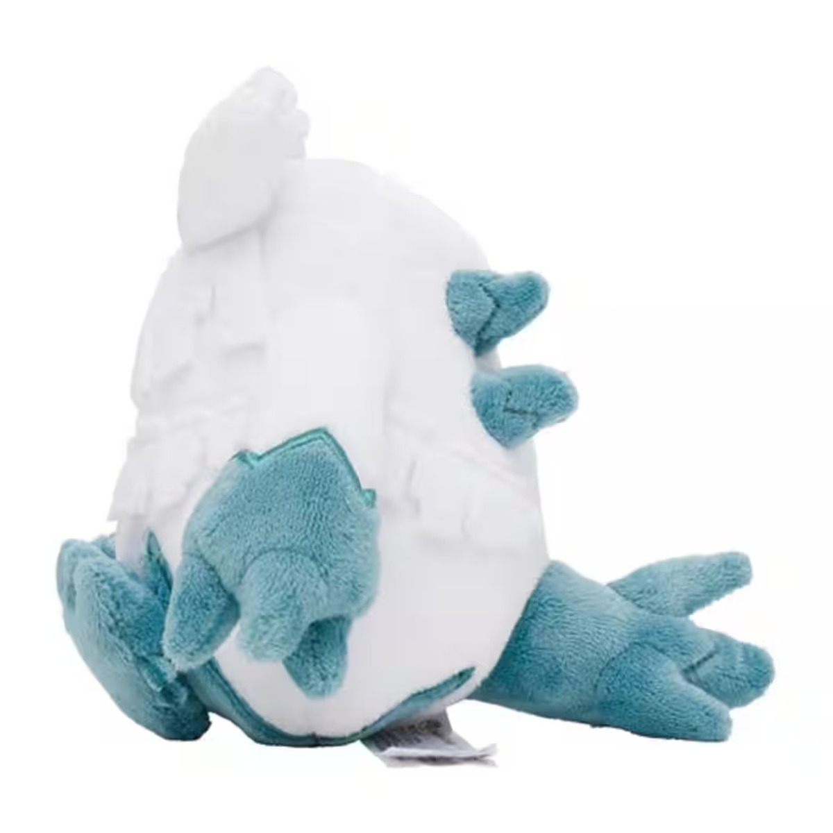 Ein Stofftier in Form eines Vogels mit weißem Körper und blauen Füßen und Akzenten. Es liegt auf der Seite.