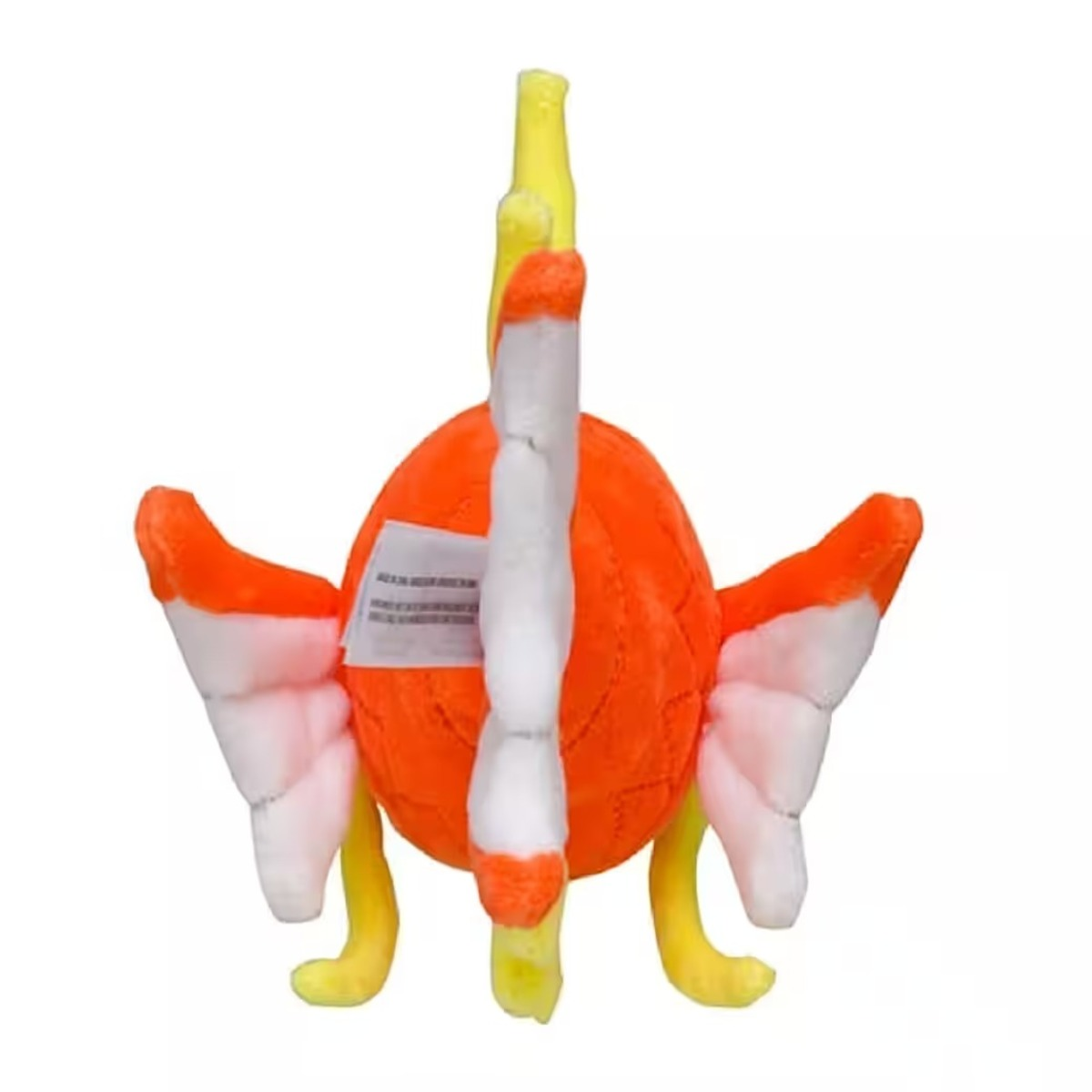 Ein orangefarbenes Plüschtier mit weißen und orangefarbenen Flossen. Es hat gelbe Beine und eine gelbe Flosse oben. Ein Etikett ist daran befestigt.