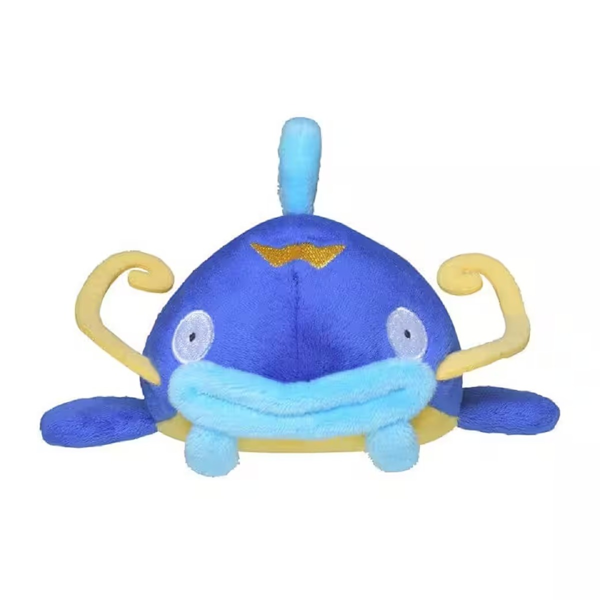 Ein blaues Plüschtier, das einem Zeichentrickfisch ähnelt, mit gelben Antennen und Flossen. Es hat einen blauen Körper, einen gelben Bauch und kleine Augen.