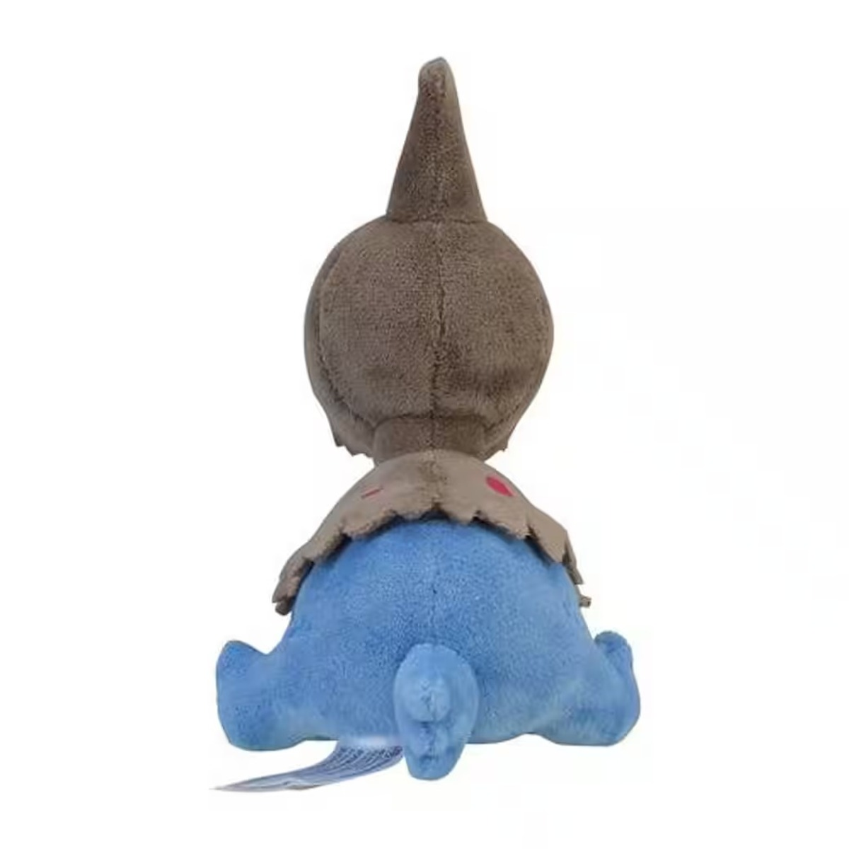 Ein Kuscheltier, brauner Kopf und blauer Körper. Es hat einen Schwanz und ein kragenartiges Design auf weißem Hintergrund. Das Spielzeug ist von hinten zu sehen.