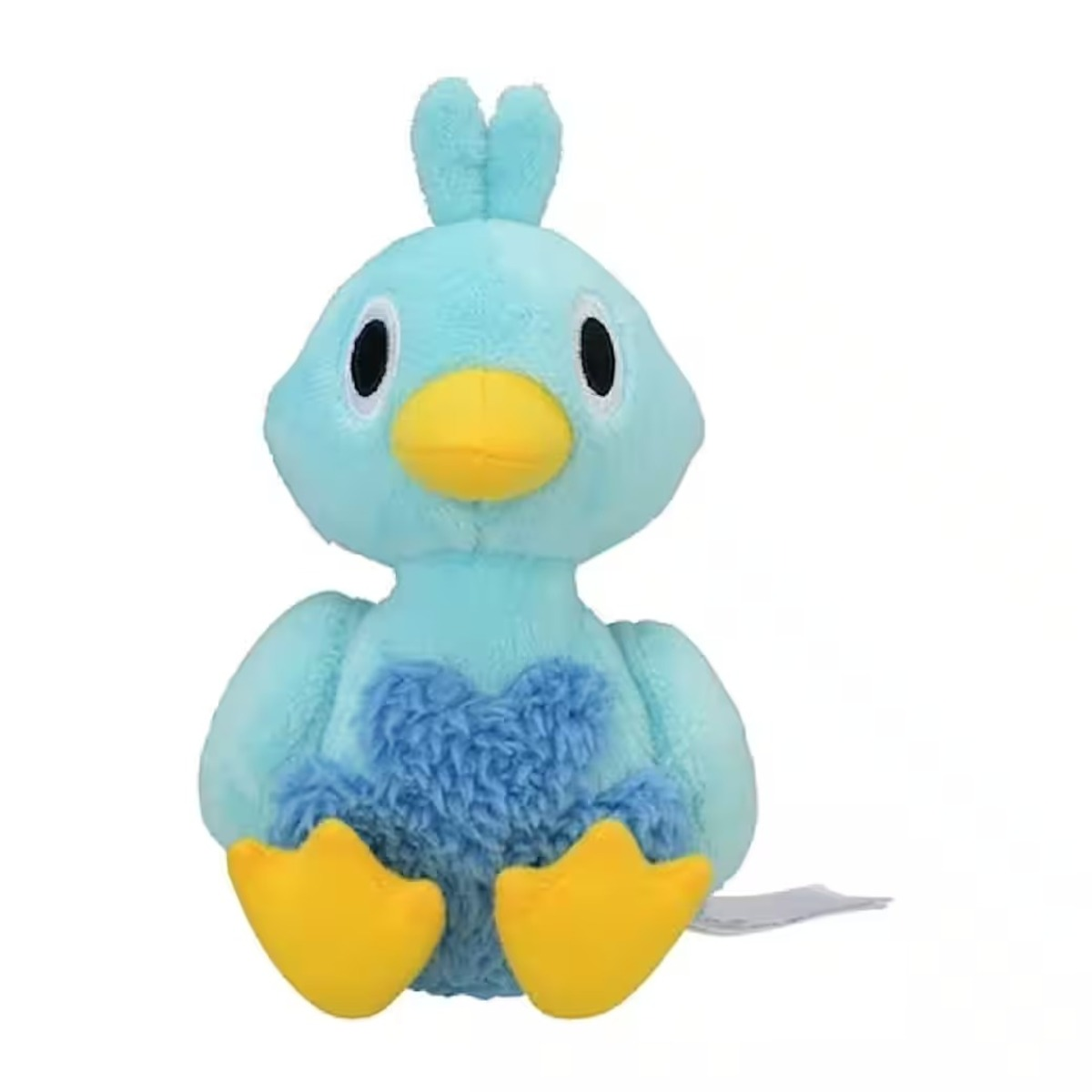 Ein Stofftier-Ente. Sie ist blau mit gelbem Schnabel und Füßen und einem Büschel blauen Fells auf der Brust. Der Hintergrund ist weiß.
