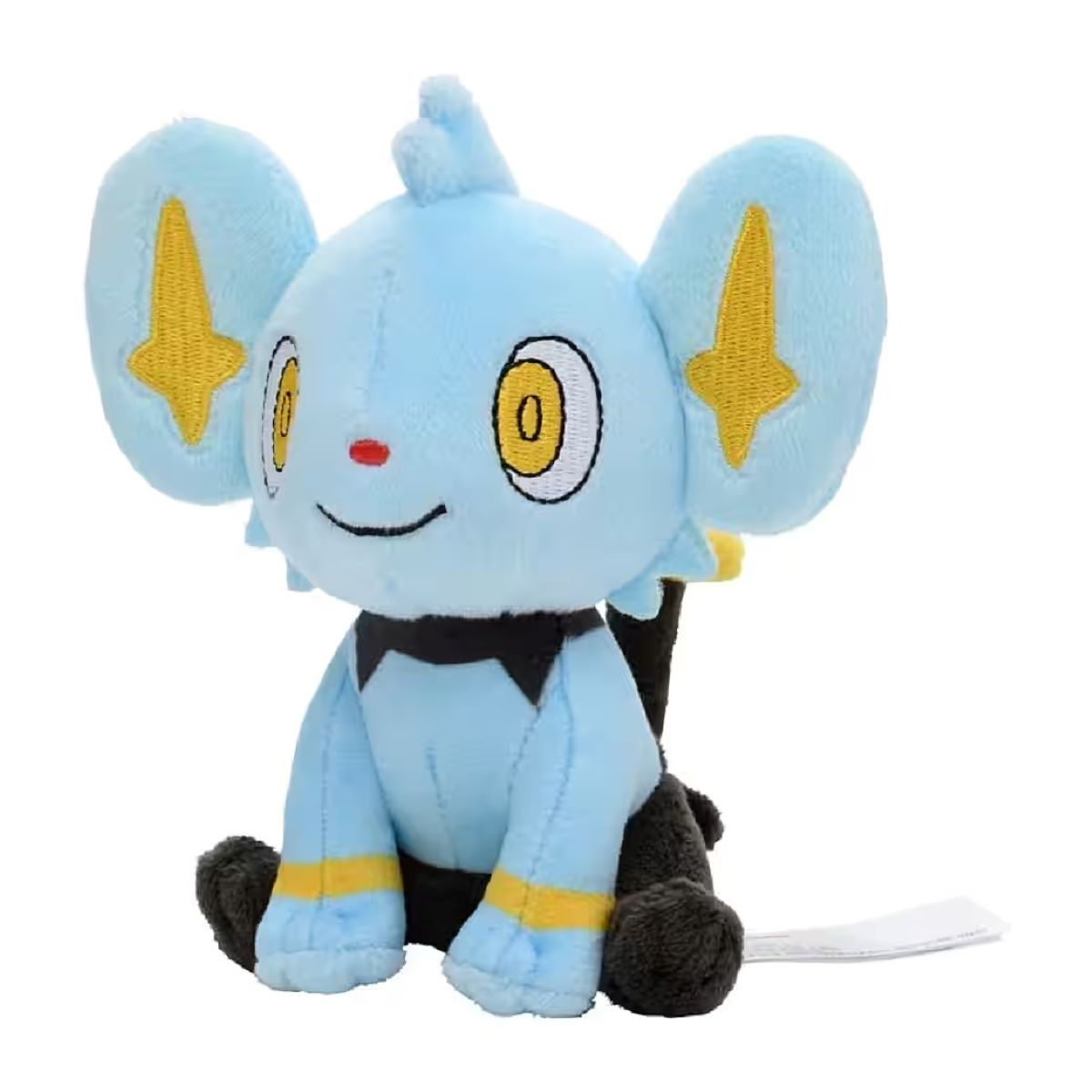Ein blaues Shinx-Plüschtier mit gelben Akzenten an Ohren und Pfoten. Es hat schwarze Pfoten und eine Fliege. Es lächelt.